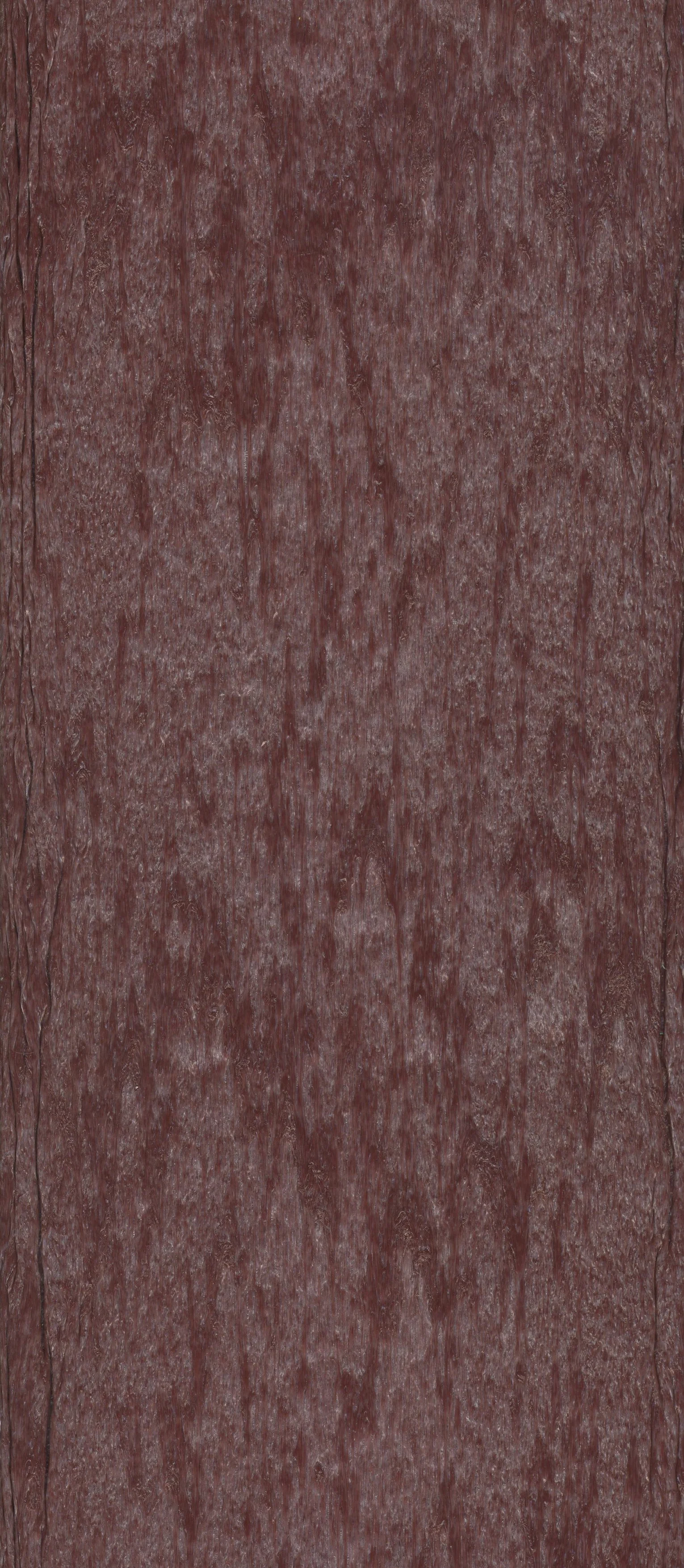 Close-up of a textured, reddish-brown wooden surface with visible grain patterns and cracks.