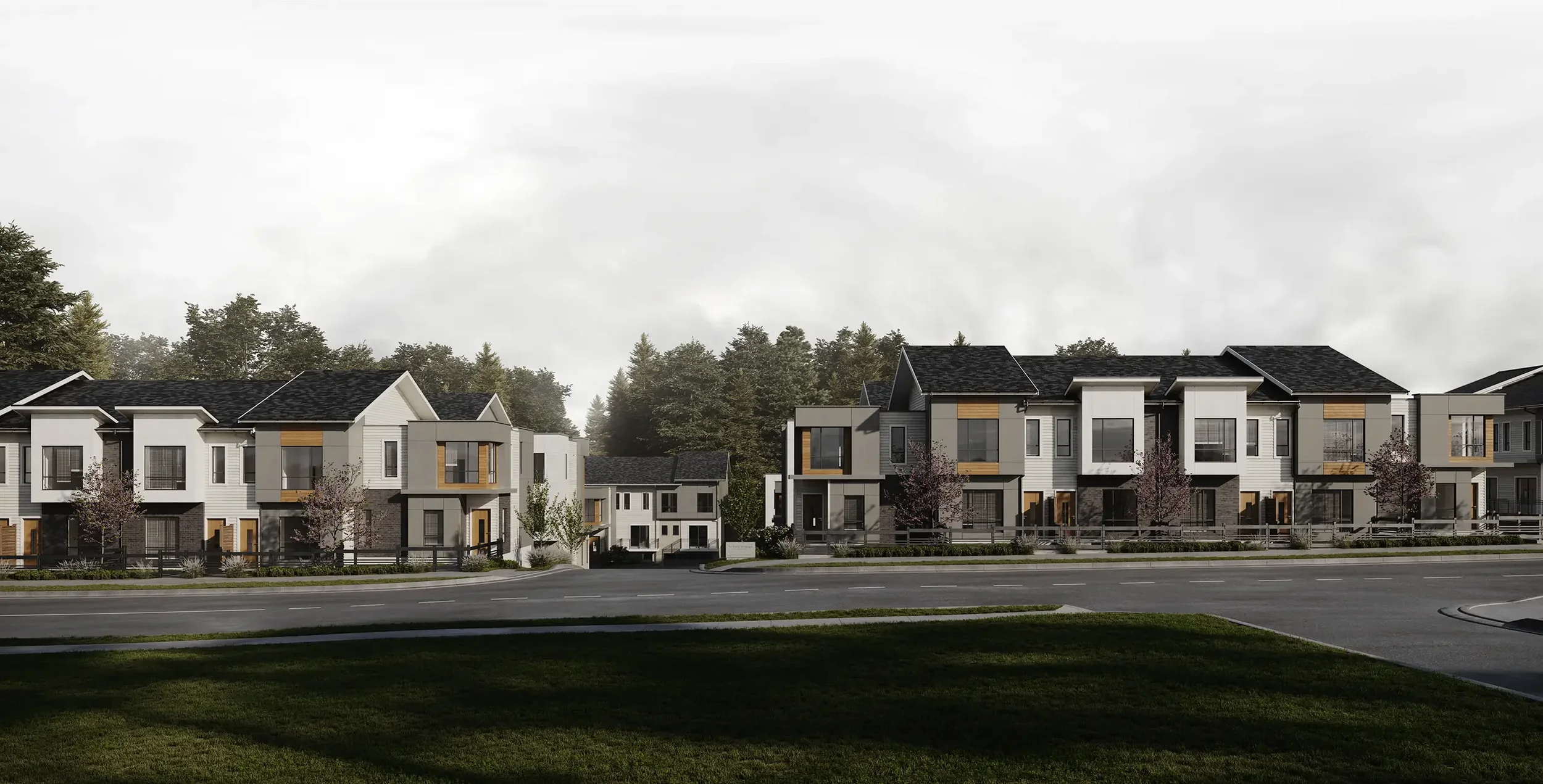 Exterior rendering of townhomes with grey sky and large trees in the background