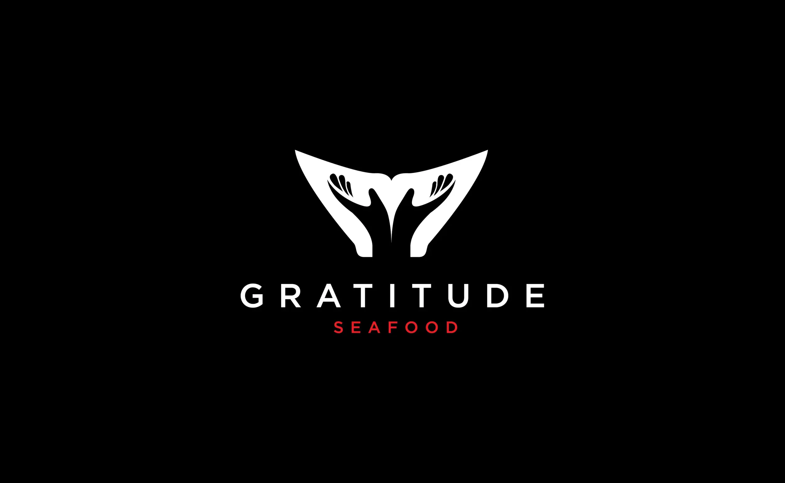 Gratitude Seafood logo featuring a whale tale and outstretched hands within them as a symbol of welcome