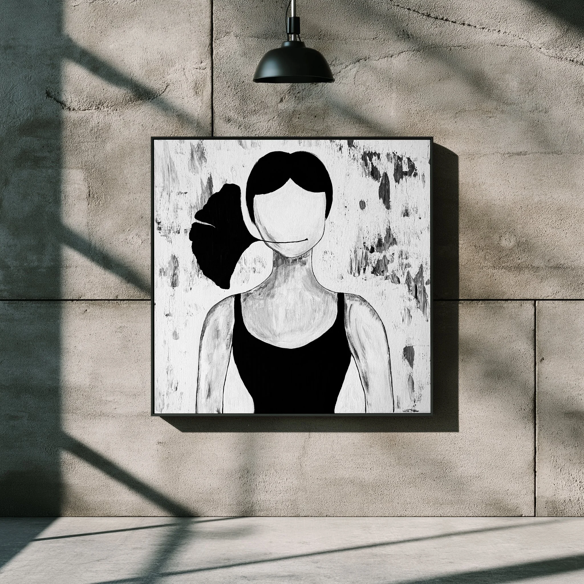 Black and white abstract portrait of a woman with dark hair in a ponytail, wearing a tank top, with no facial features, hanging on a concrete wall under a black lamp.