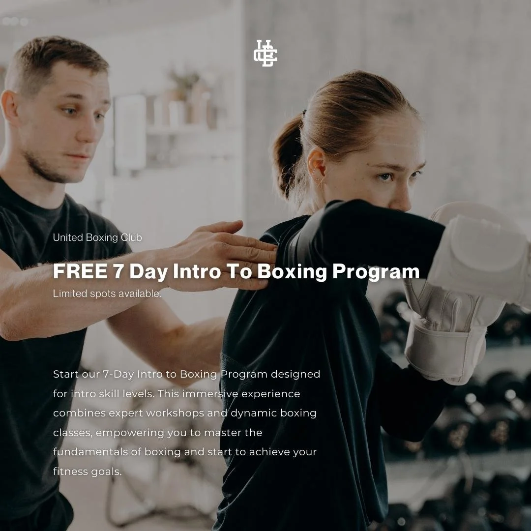 A woman practicing boxing with a trainer guiding her, in a gym setting. The woman is wearing boxing gloves and appears to be striking a punch, while the trainer assists her.