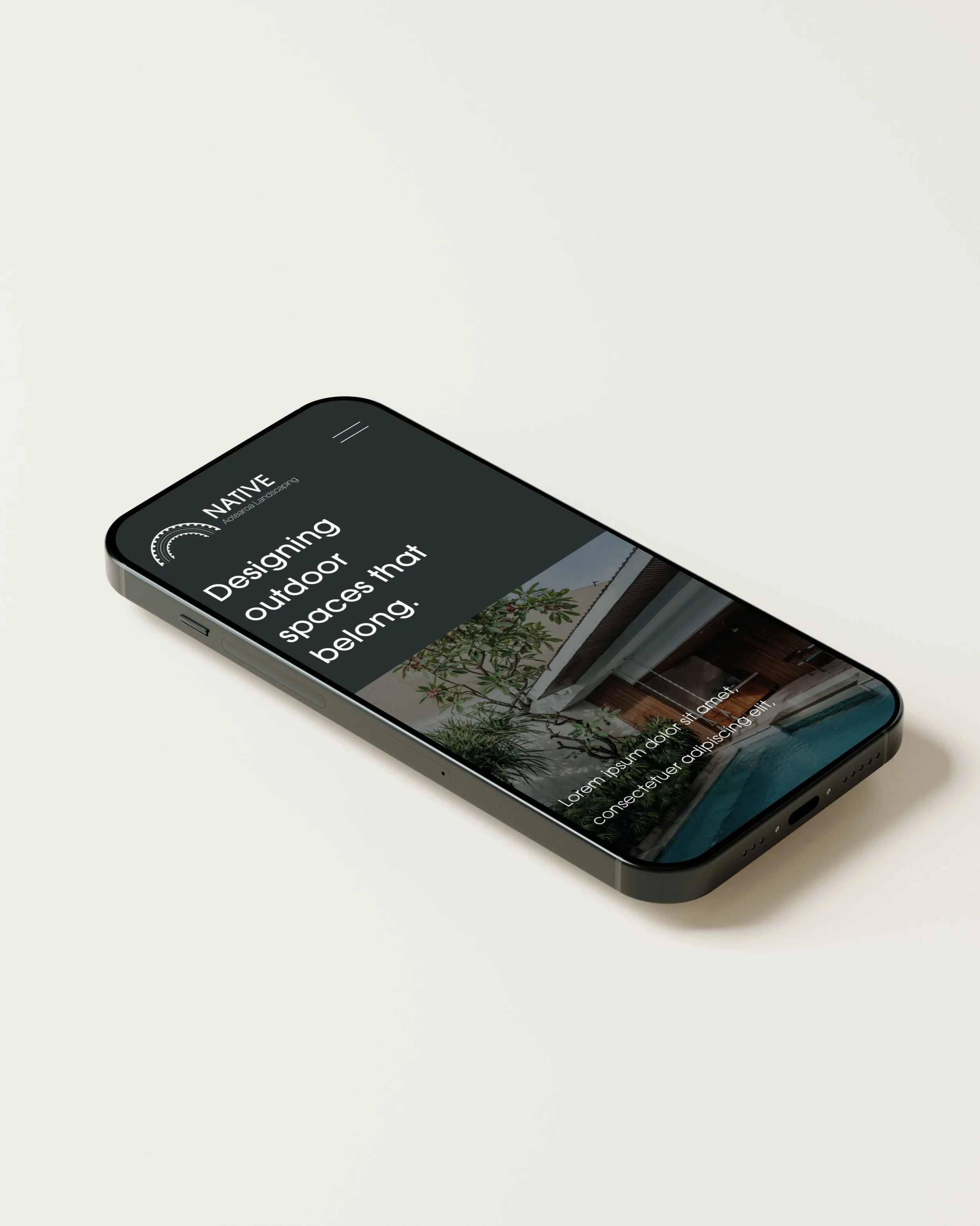 Smartphone displaying website about designing outdoor spaces, with a garden and pool image.