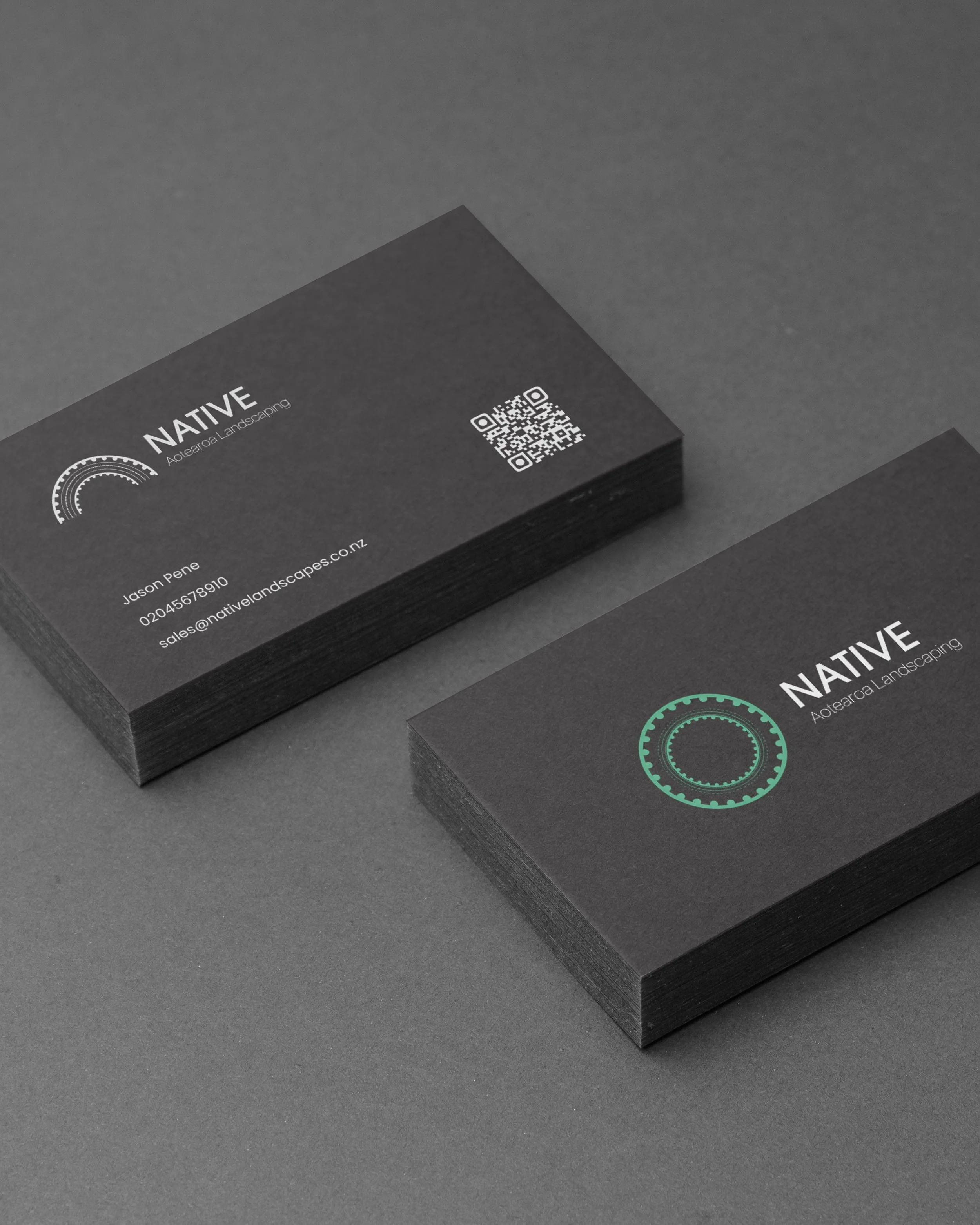 Black business cards for Native Aotearoa Landscaping with a logo, contact information, and a QR code.