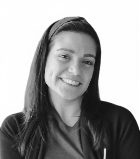Portrait of a smiling woman (CCO Carla) with dark hair, against a white background.