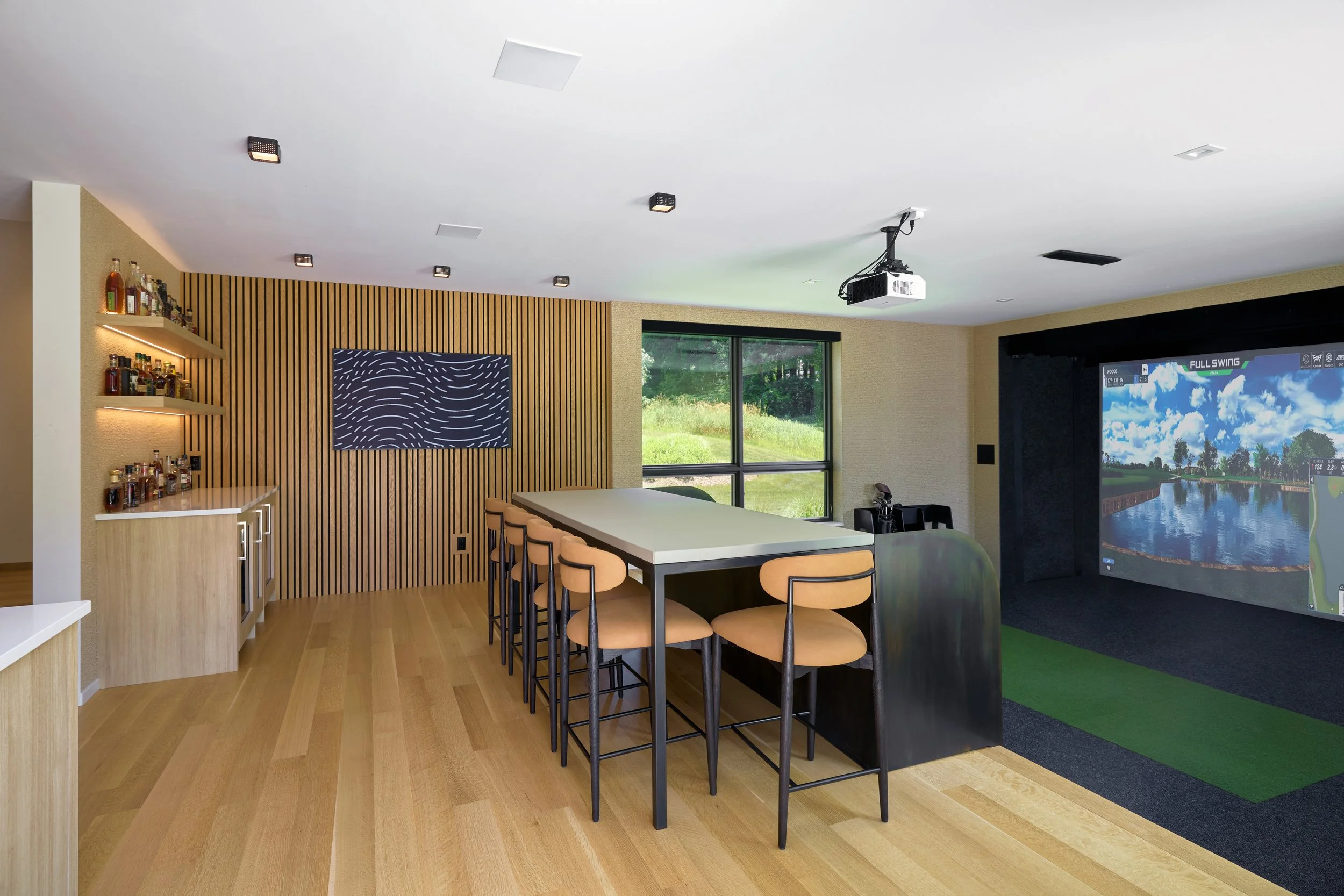 Golf simulator, lounge area and bar