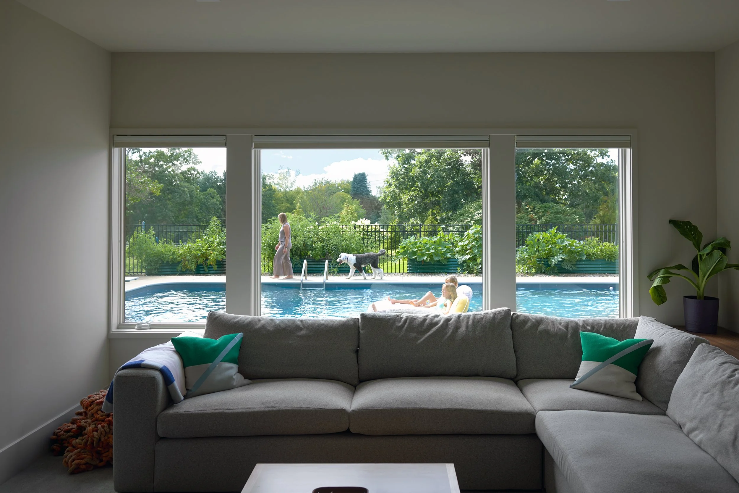 Lower level family room overlooking swimming pool