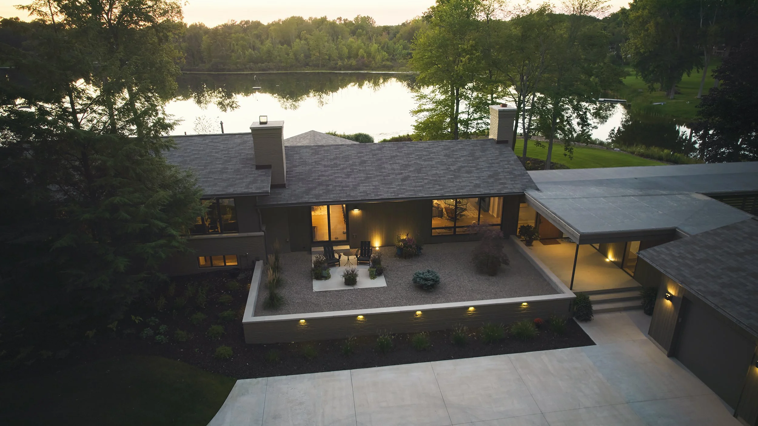 High end, lakefront custom home renovation featuring modern and midcentury modern design in Cascade, Michigan