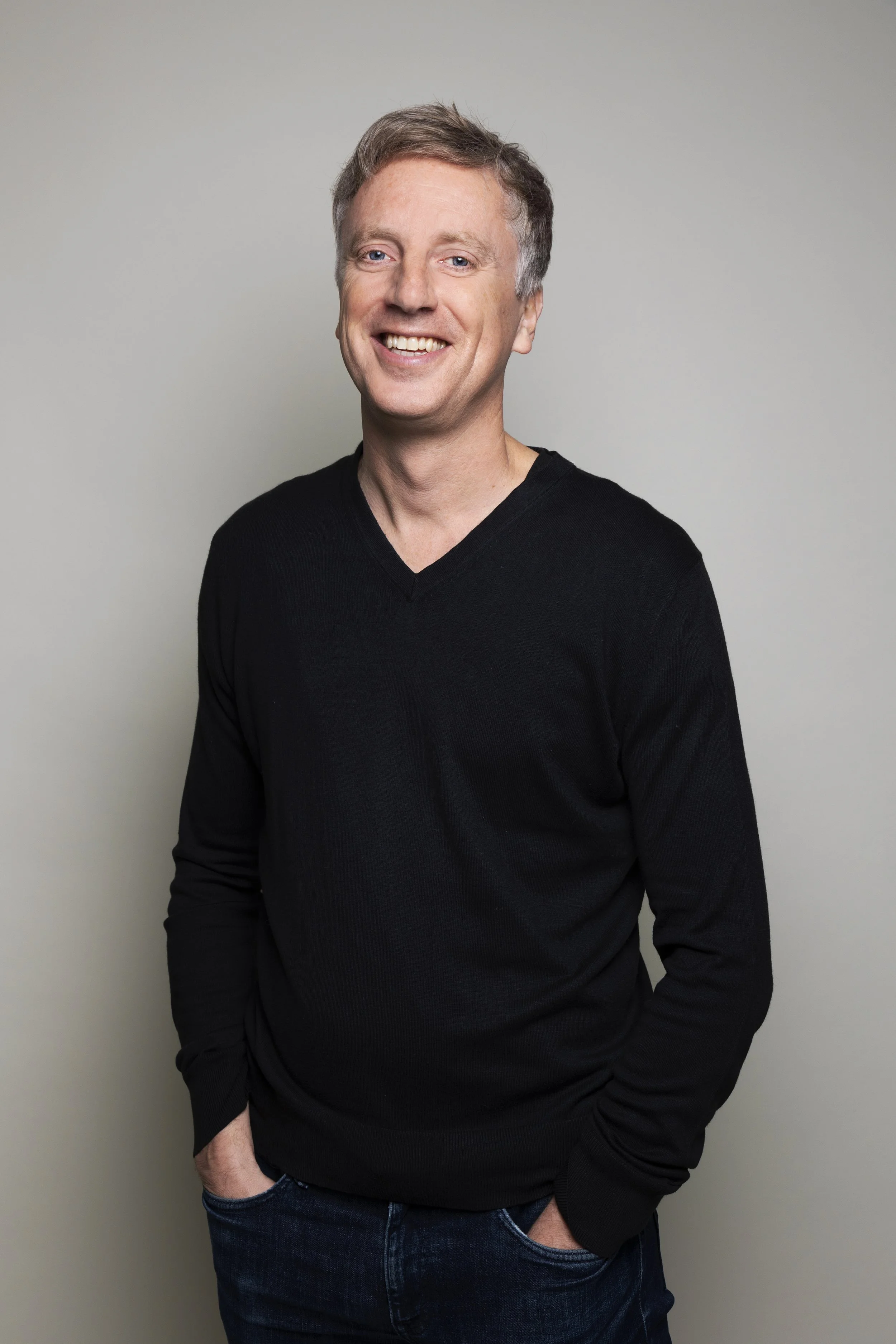 Portrait of Fabien Girardin — engineer, researcher, and design fiction pioneer — smiling with hands in pockets against a neutral background.