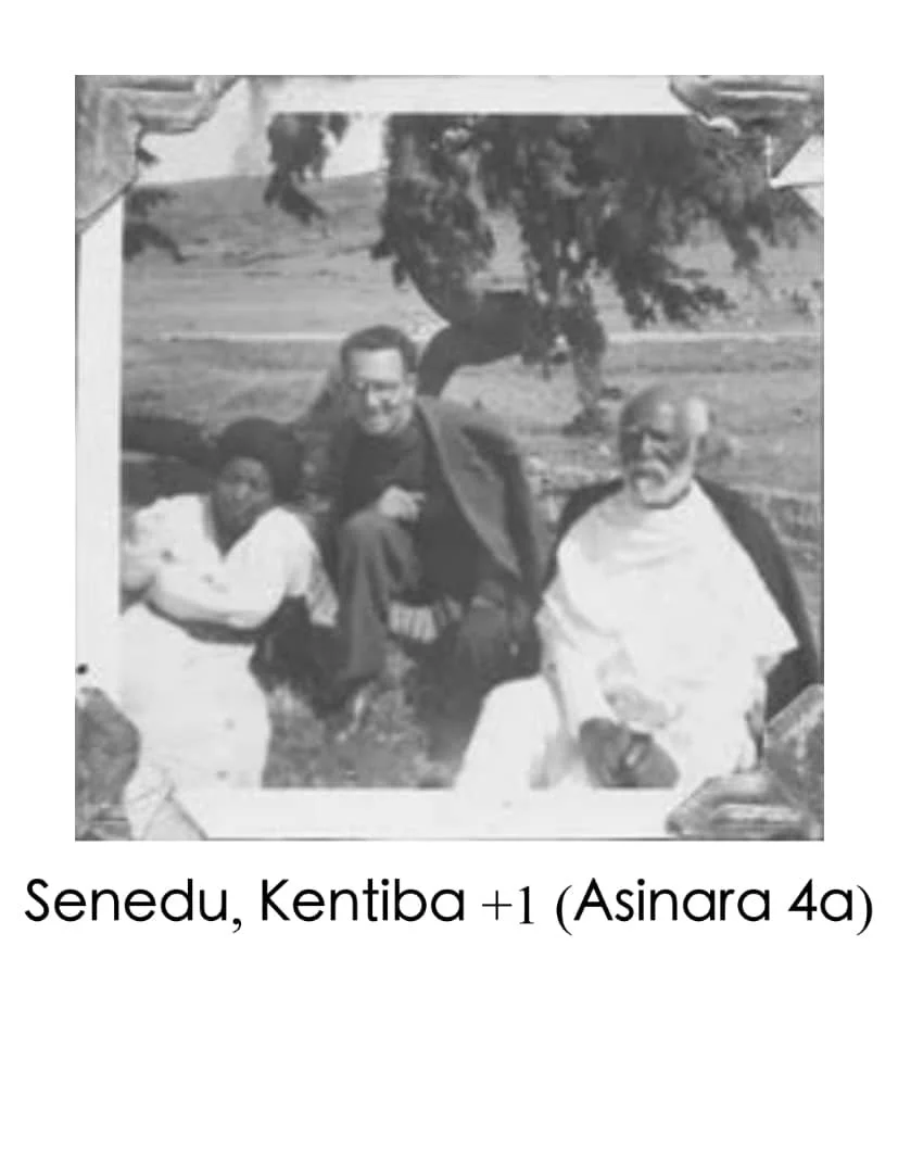 Black and white photo of three people sitting outdoors near a tree, with a man kneeling and two others sitting on the ground, and a banner with text in Swahili below.