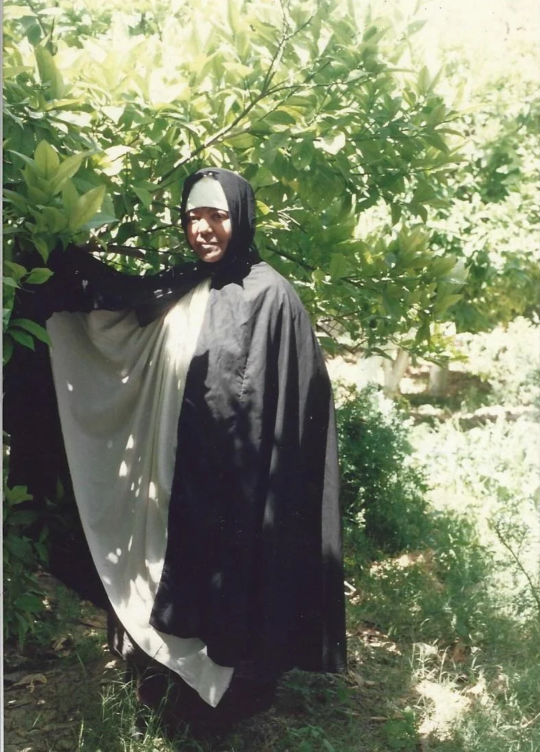 Emahoy in a garden