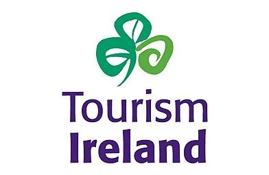 Tourism Ireland logo with a green shamrock symbol and purple text.