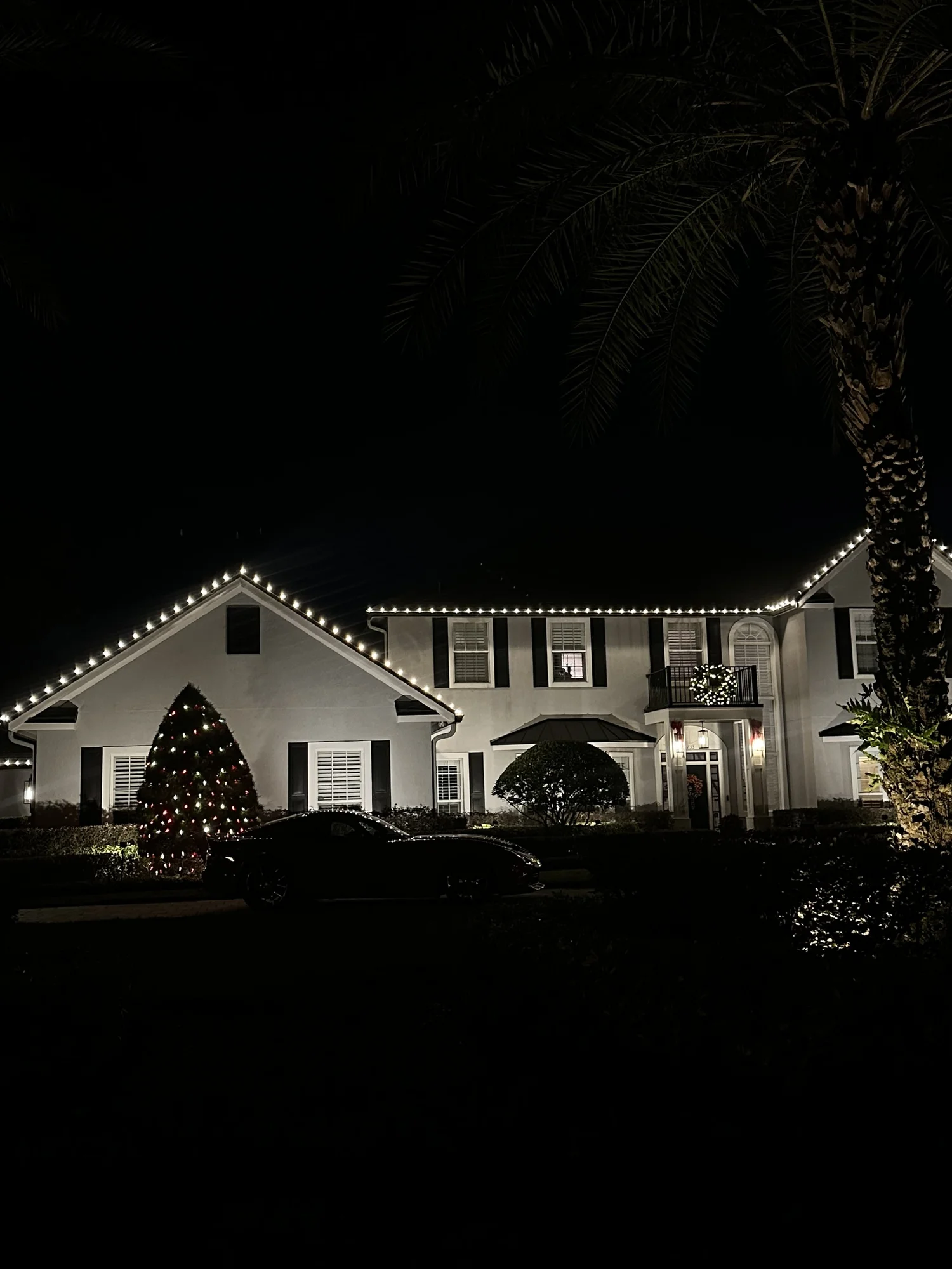 Central Florida home with a classic custom white Christmas light display