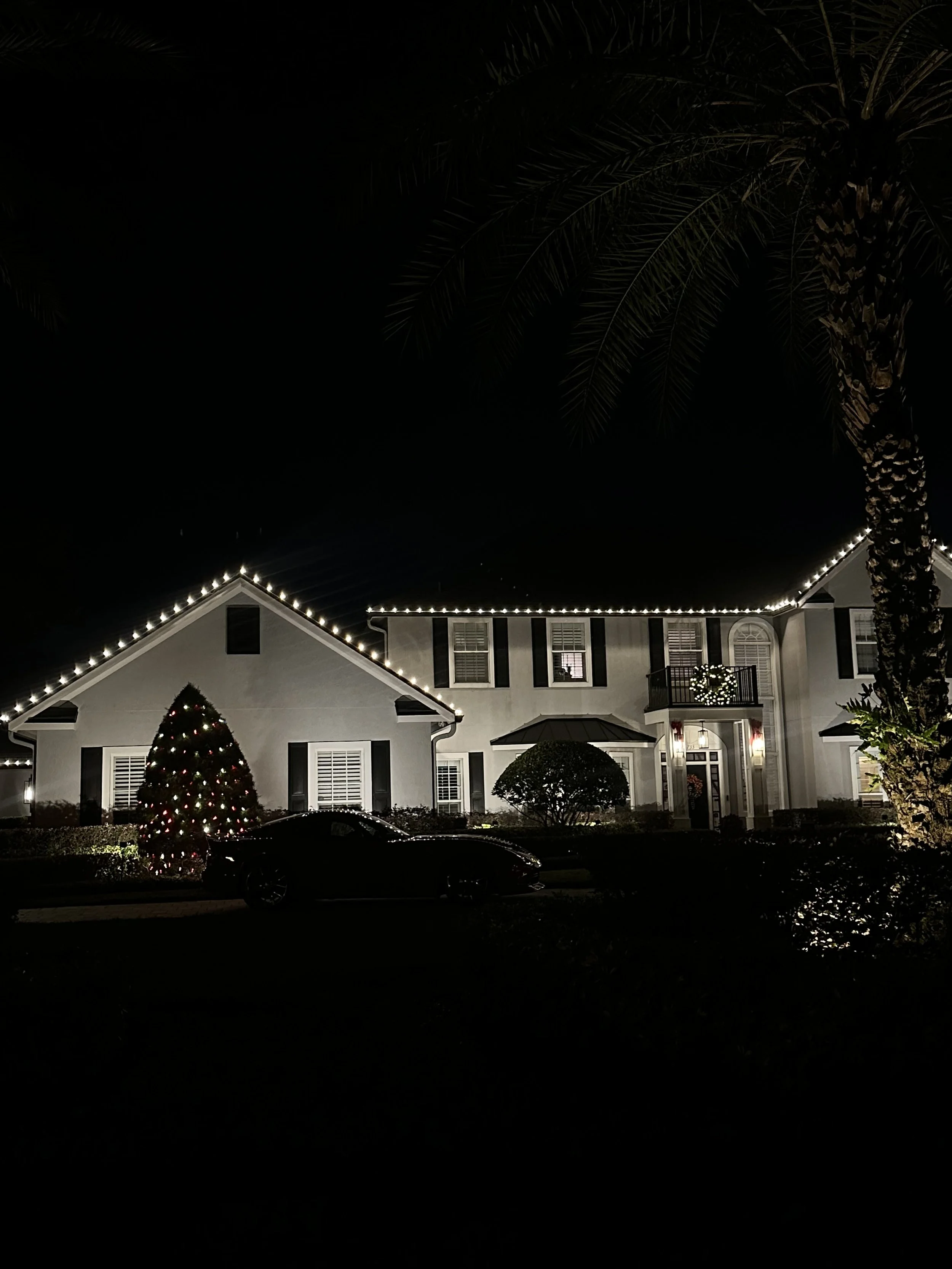 Central Florida home with an elegant white Christmas light display