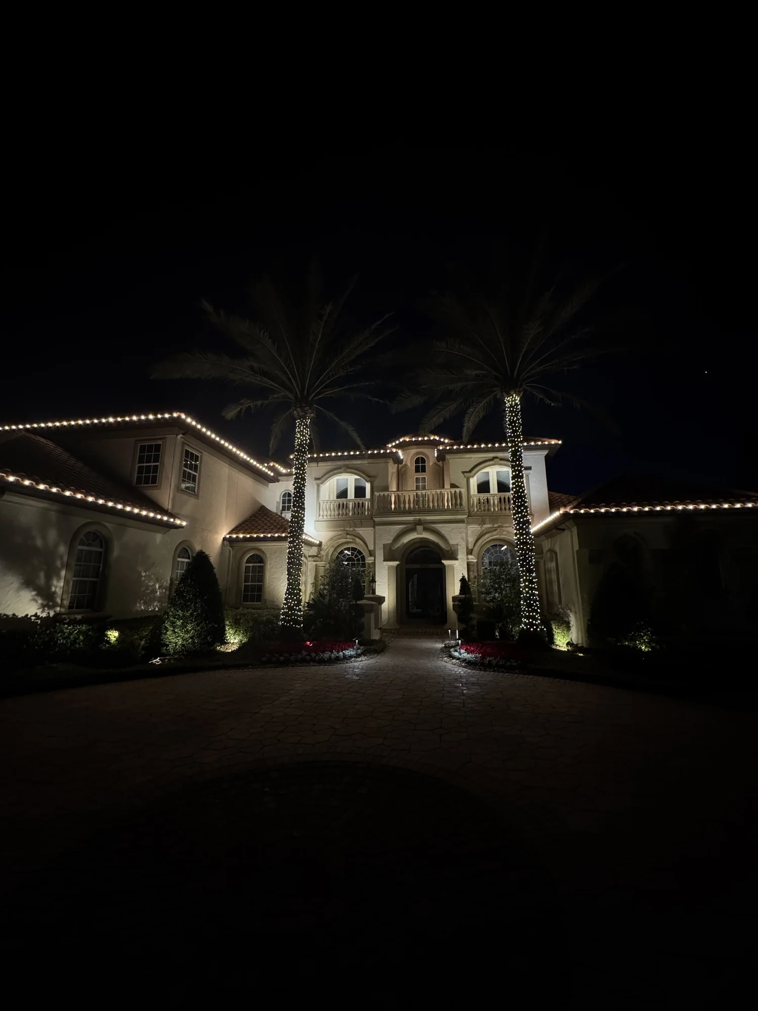 Luxury Orlando residence outlined with warm white Christmas lights