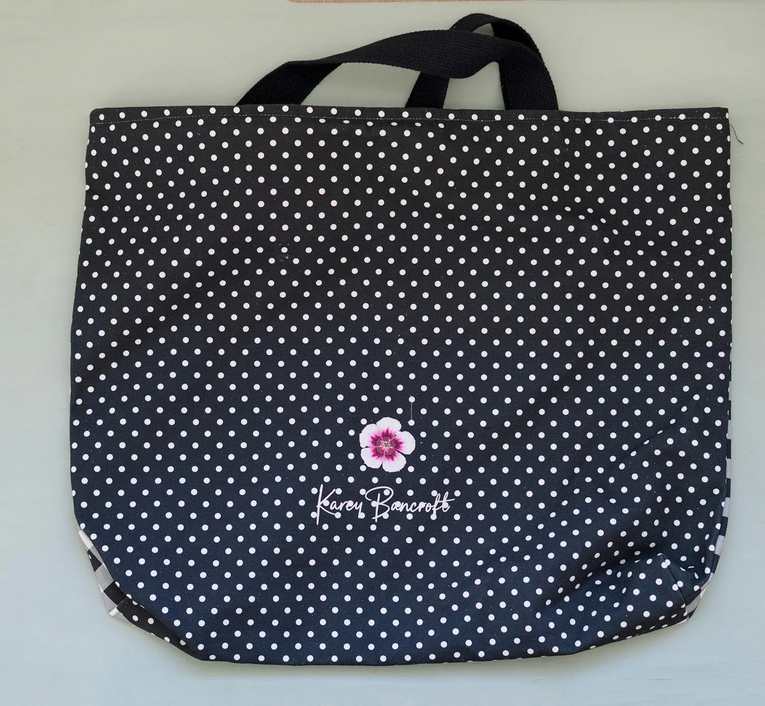 Karey-Bancroft_2026_products_back of black check tote.jpg