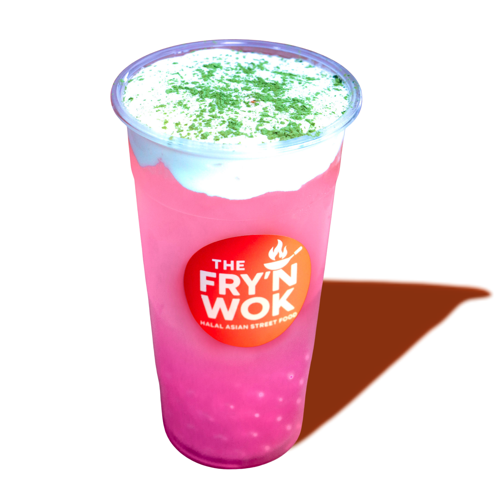 Pink frothy beverage in a clear plastic cup with a white dollop topping and green powder sprinkled on it, labeled 'The Fry'n Wok, Halal Asian Street Food', with a brown triangular fortune cookie beside it.