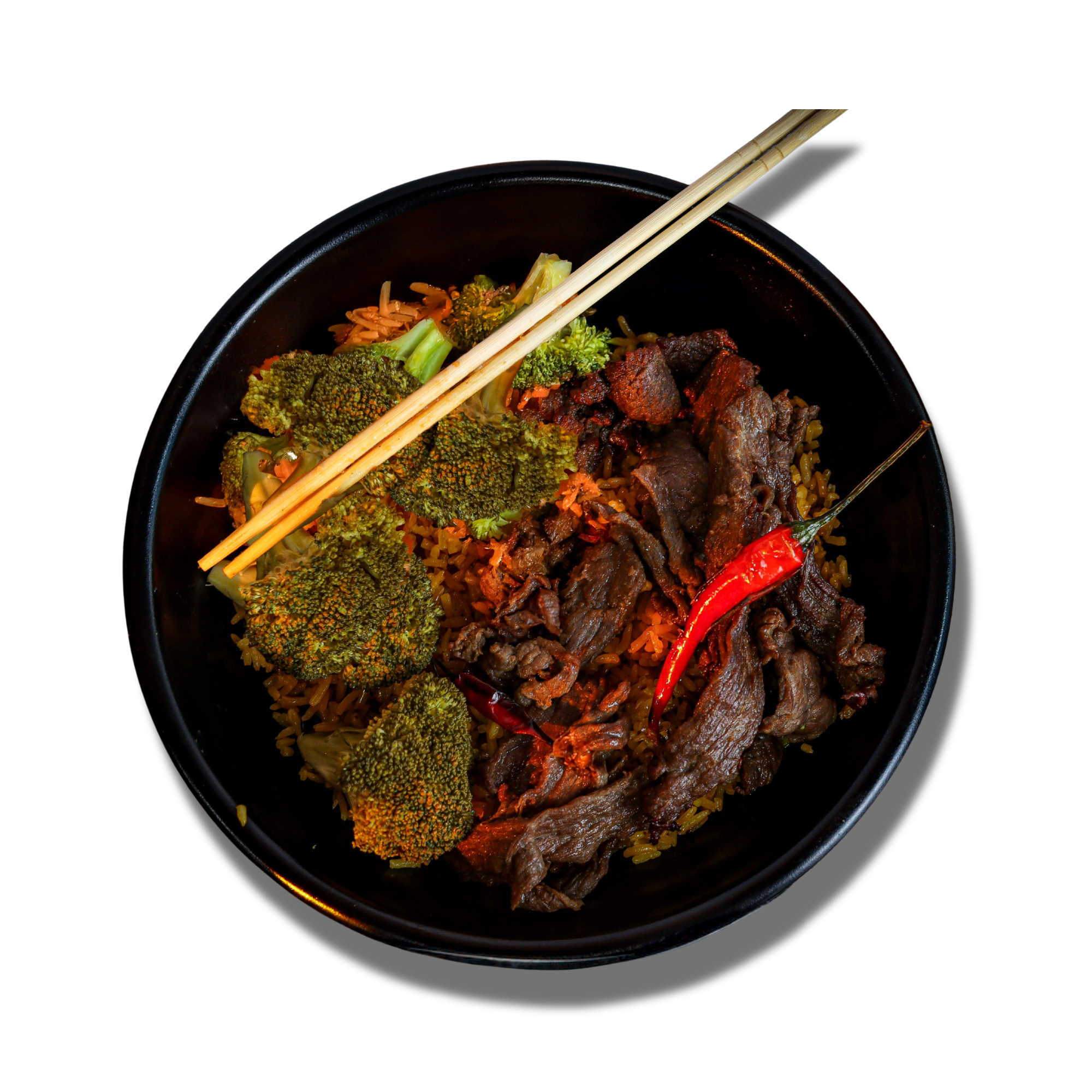 A black bowl containing wok-tossed beef, broccoli, and rice, garnished with a red chili and wooden chopsticks.