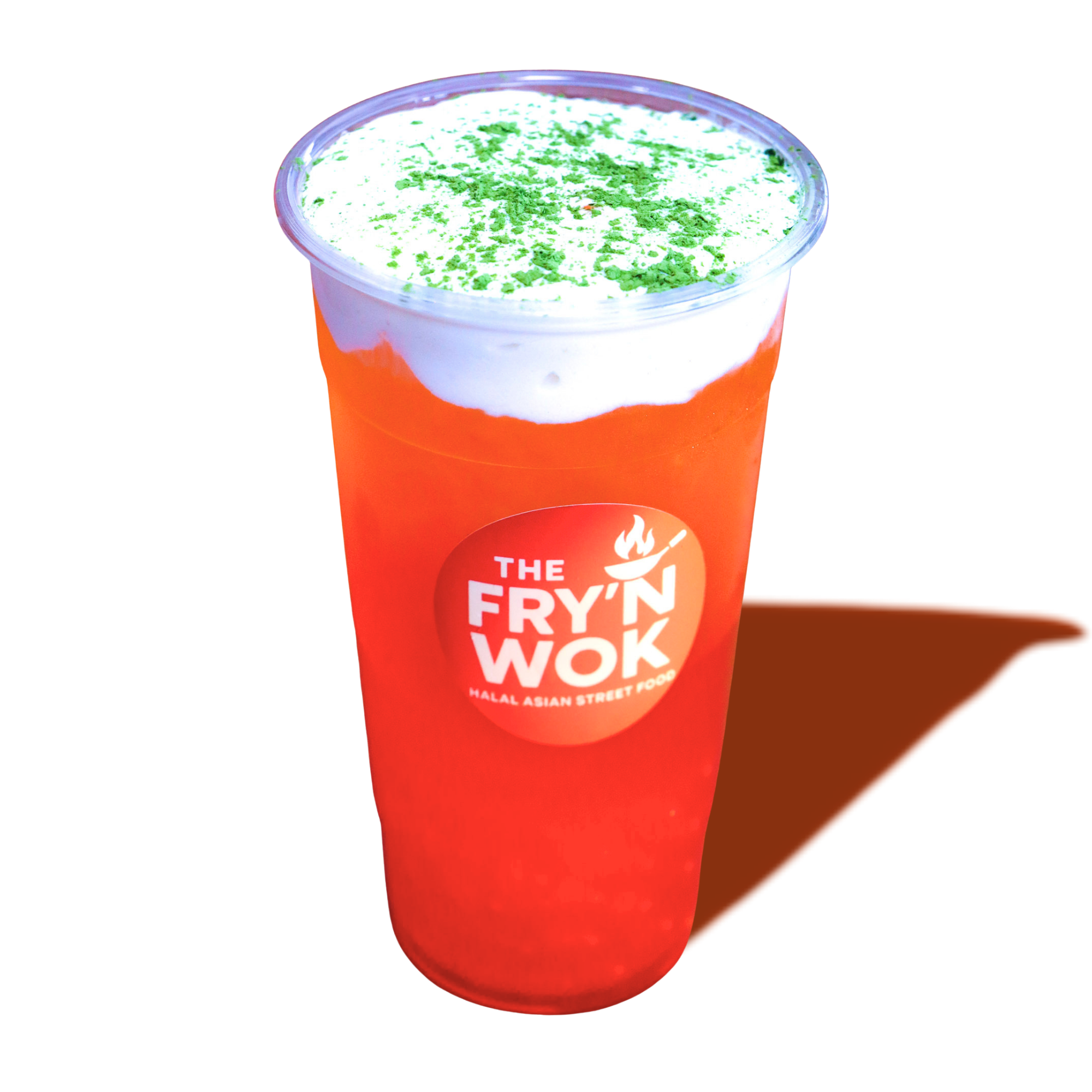 A cup of Thai iced tea from The Fry'n Wok, featuring a bright orange beverage topped with white foam and green garnish, on a reflective surface.
