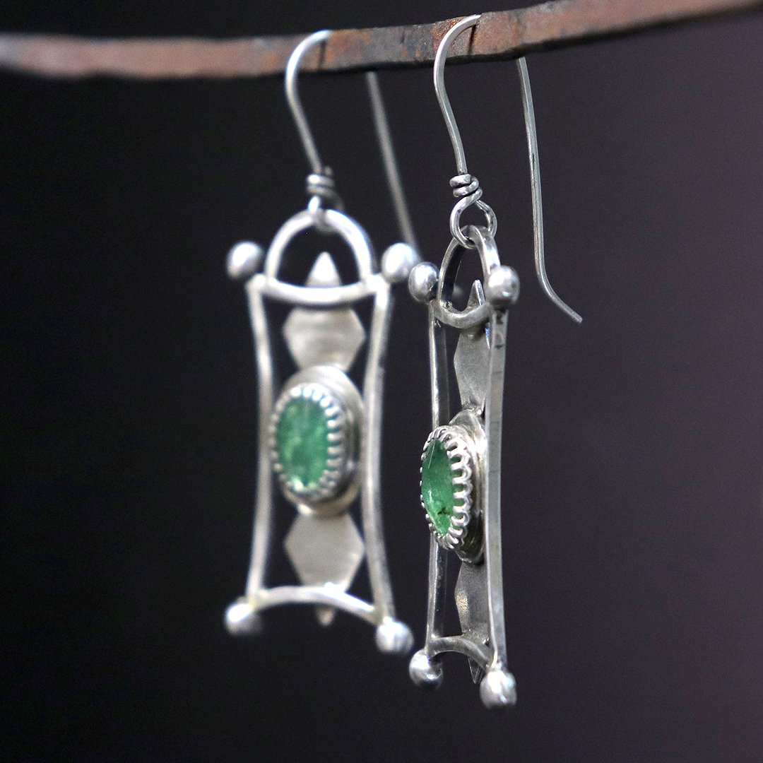 Artisan silver earrings featuring faceted green kyanite stones