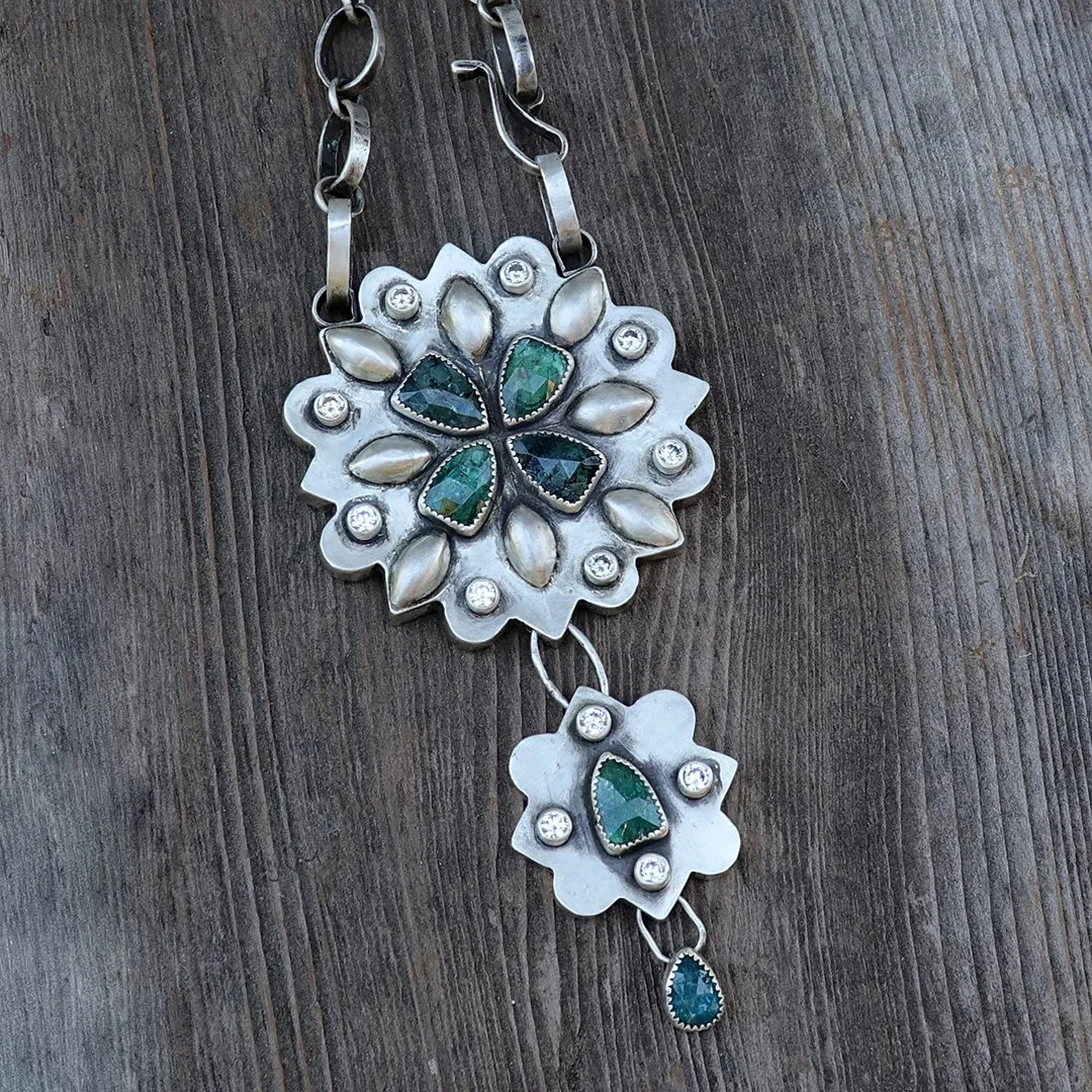 Artisan sterling silver pendant necklace with geometric floral gemstone design