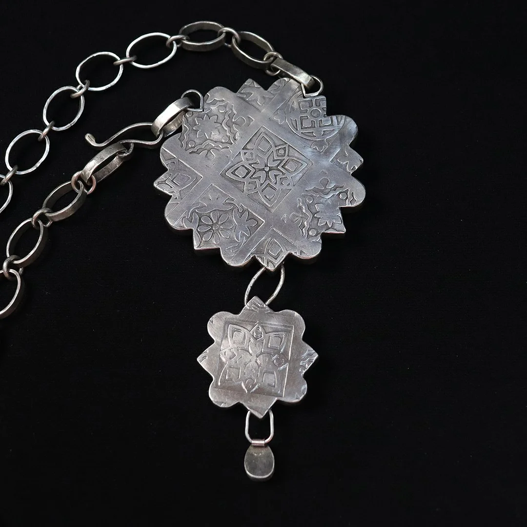 Handmade silver statement necklace featuring layered blue-green stones