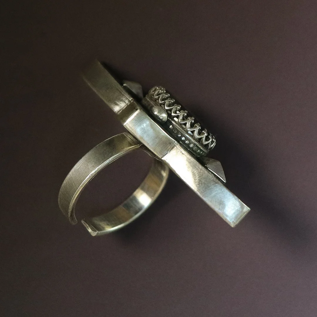 Modern handcrafted silver ring set with faceted labradorite stone