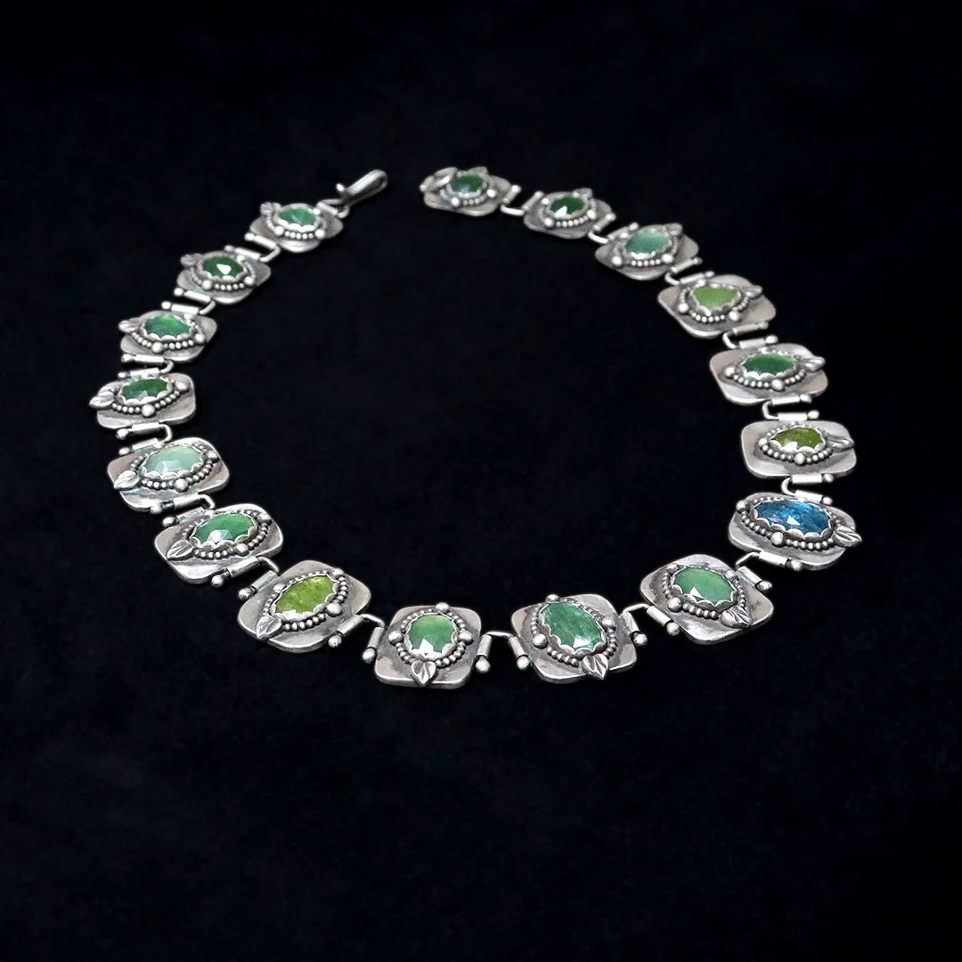 Artisan gemstone necklace featuring kyanite, serpentine, and prehnite