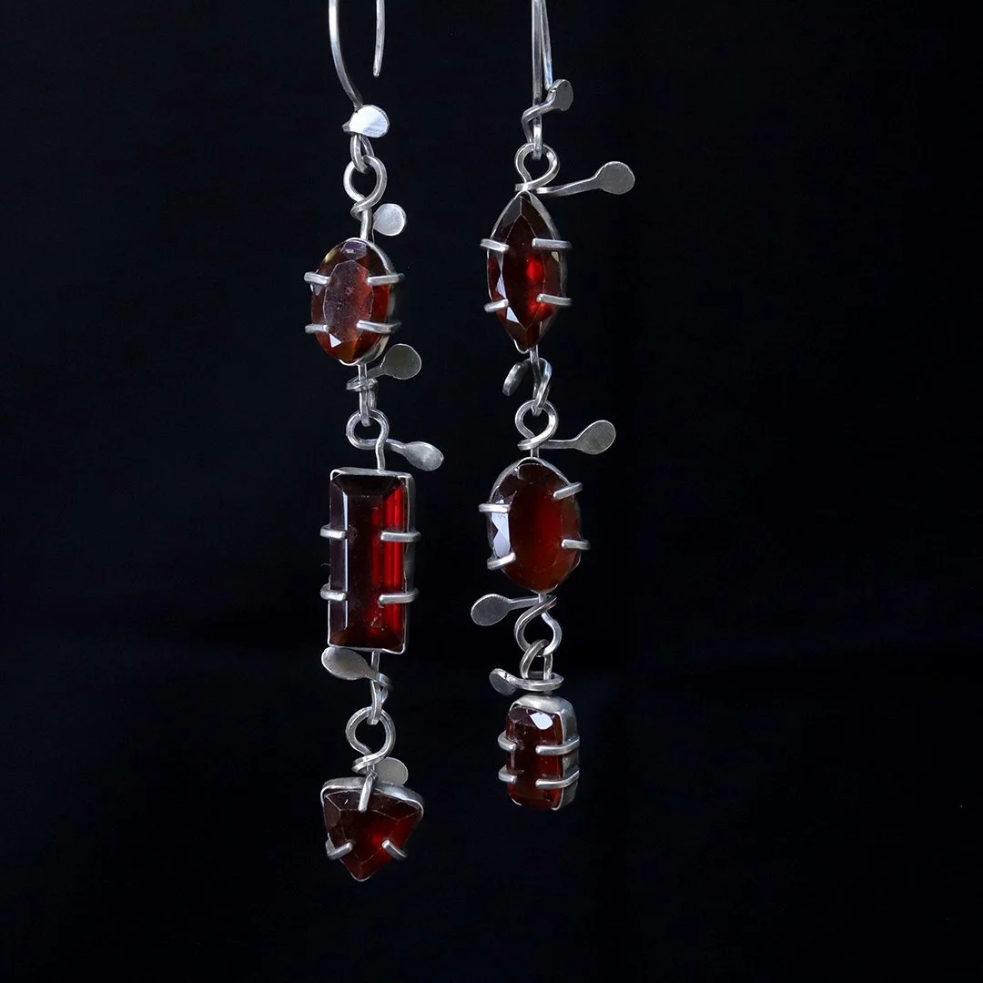 Sterling silver earrings with red garnet gemstones