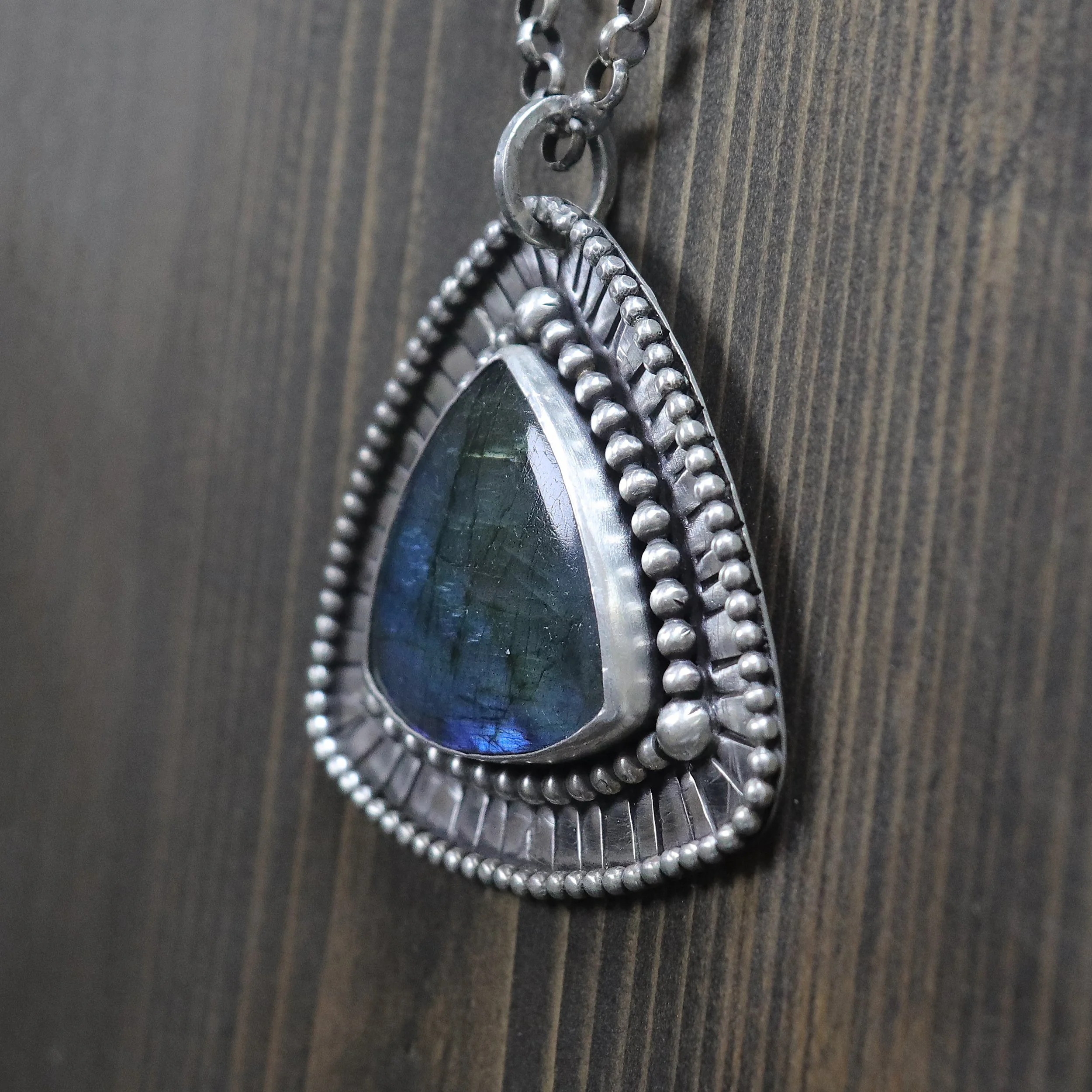 Handcrafted labradorite triangle pendant with beaded silver border