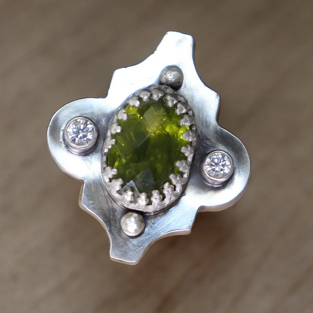 Handmade sterling silver hollow form ring with peridot and CZ accents