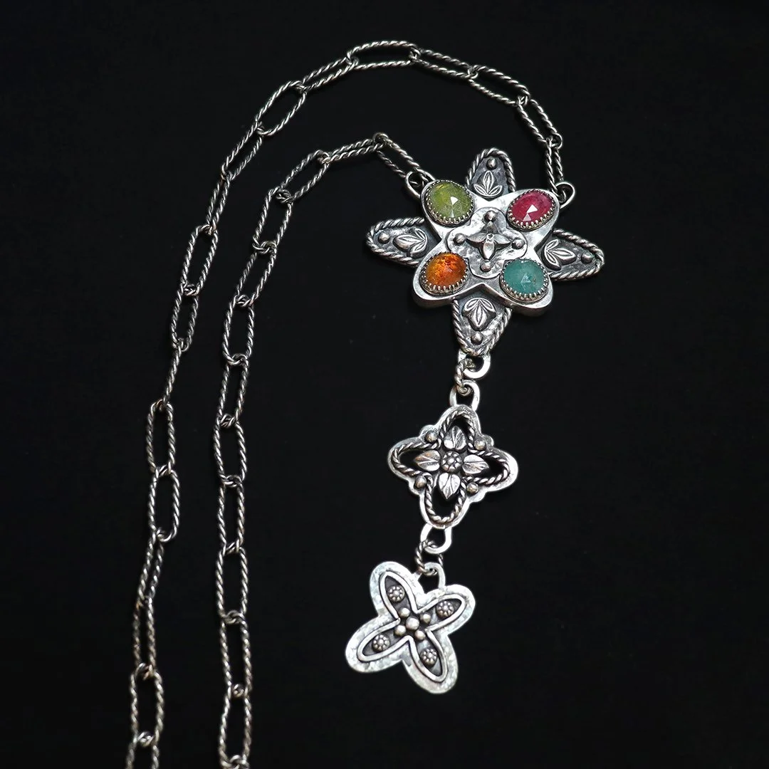 Artisan sterling silver necklace with geometric pendant and grandidierite, garnet, and vesuvianite stones