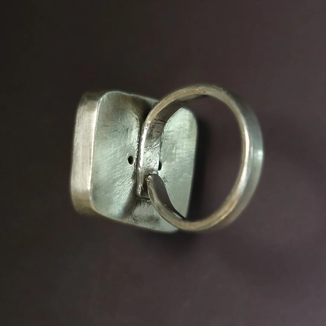 Artisan sterling silver hessonite garnet ring with geometric form