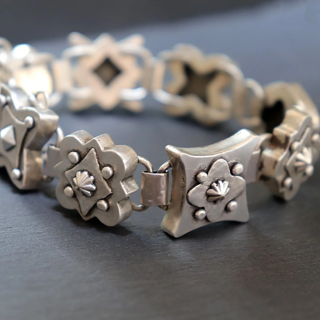 One-of-a-kind silver bracelet featuring a sculptural hollow form medallion