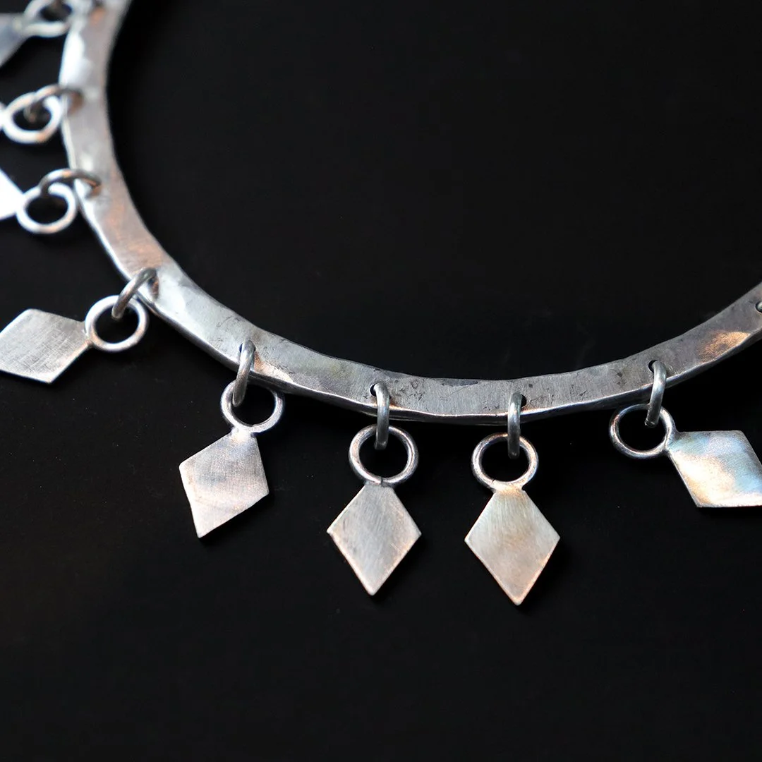 Artisan silver bangle bracelet with geometric diamond fringe details