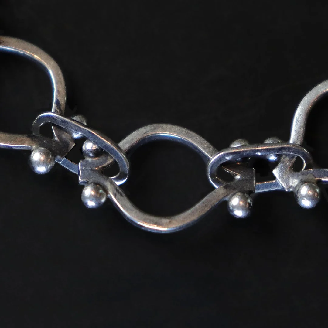 One-of-a-kind silver bracelet featuring sculpted oval chain links