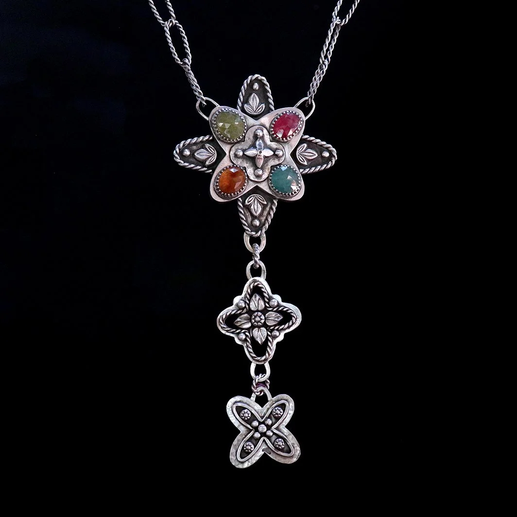 Handmade sterling silver statement necklace with multi-gem pendant featuring vesuvianite, garnet, and grandidierite