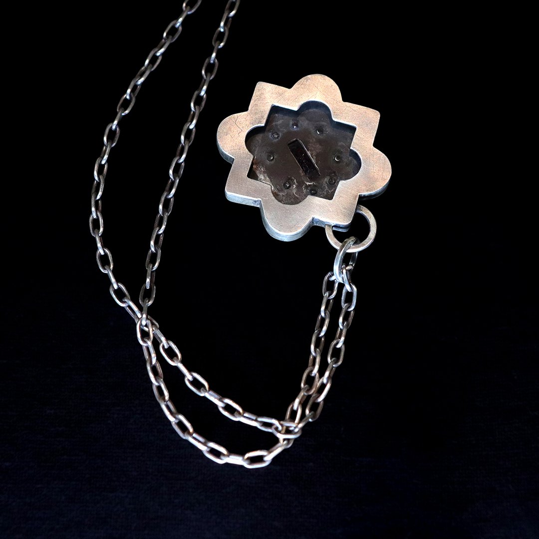 Sterling silver pendant with rose rhodolite garnet and small cz accents