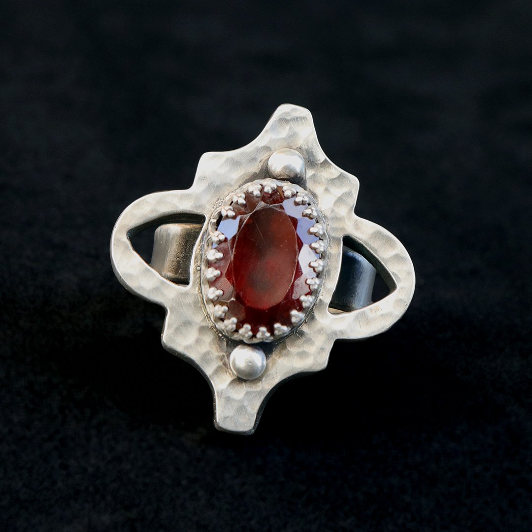 Handmade sterling silver hollow form ring with red garnet