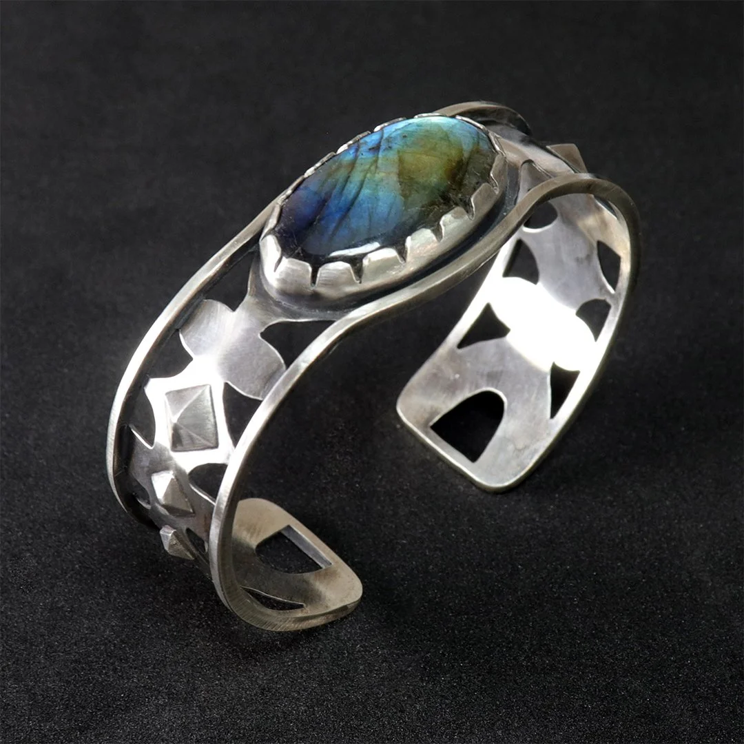 Hand-fabricated sterling silver cuff bracelet with openwork design and natural labradorite