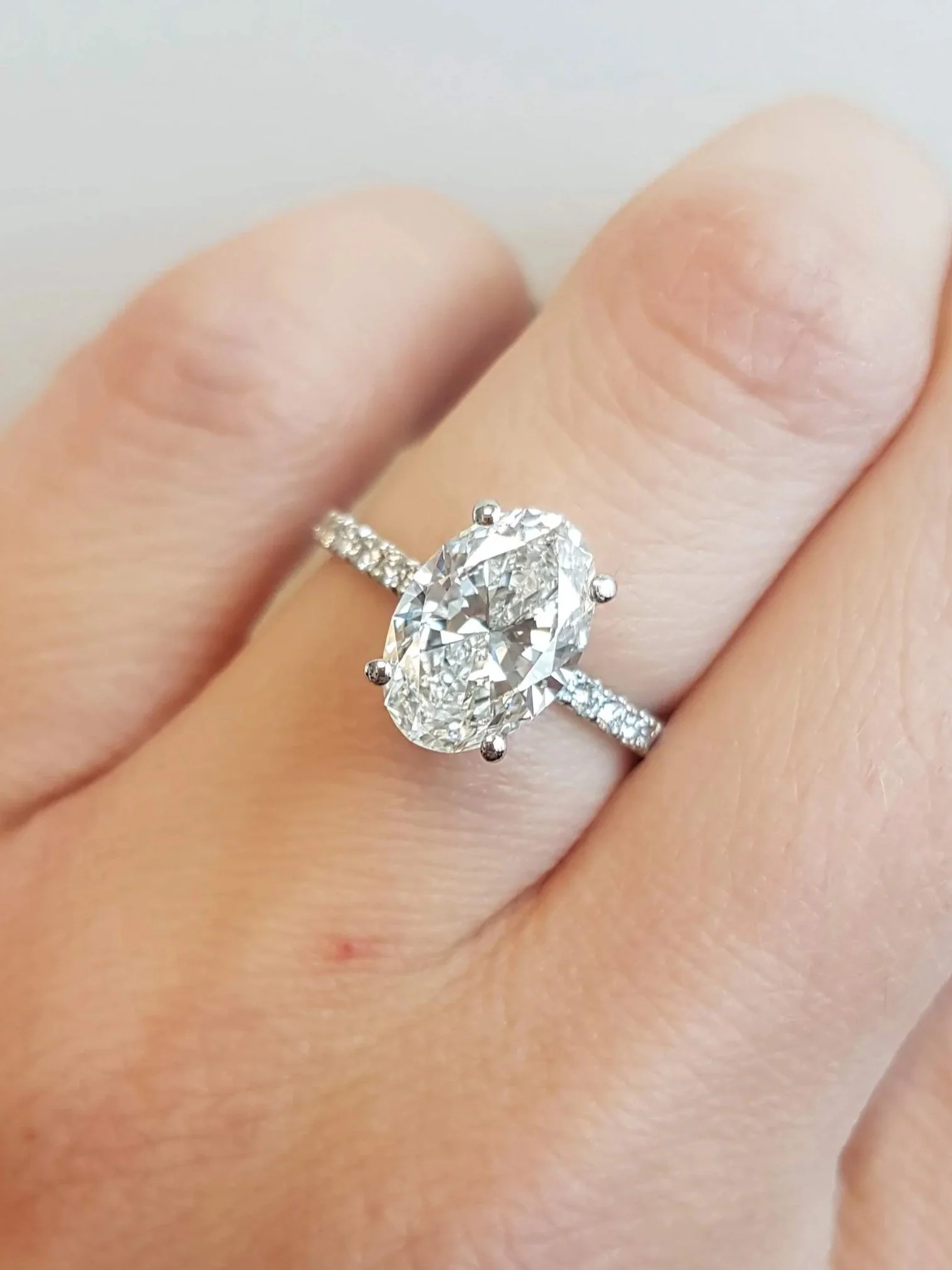 Oval cut diamond band engagement ring 