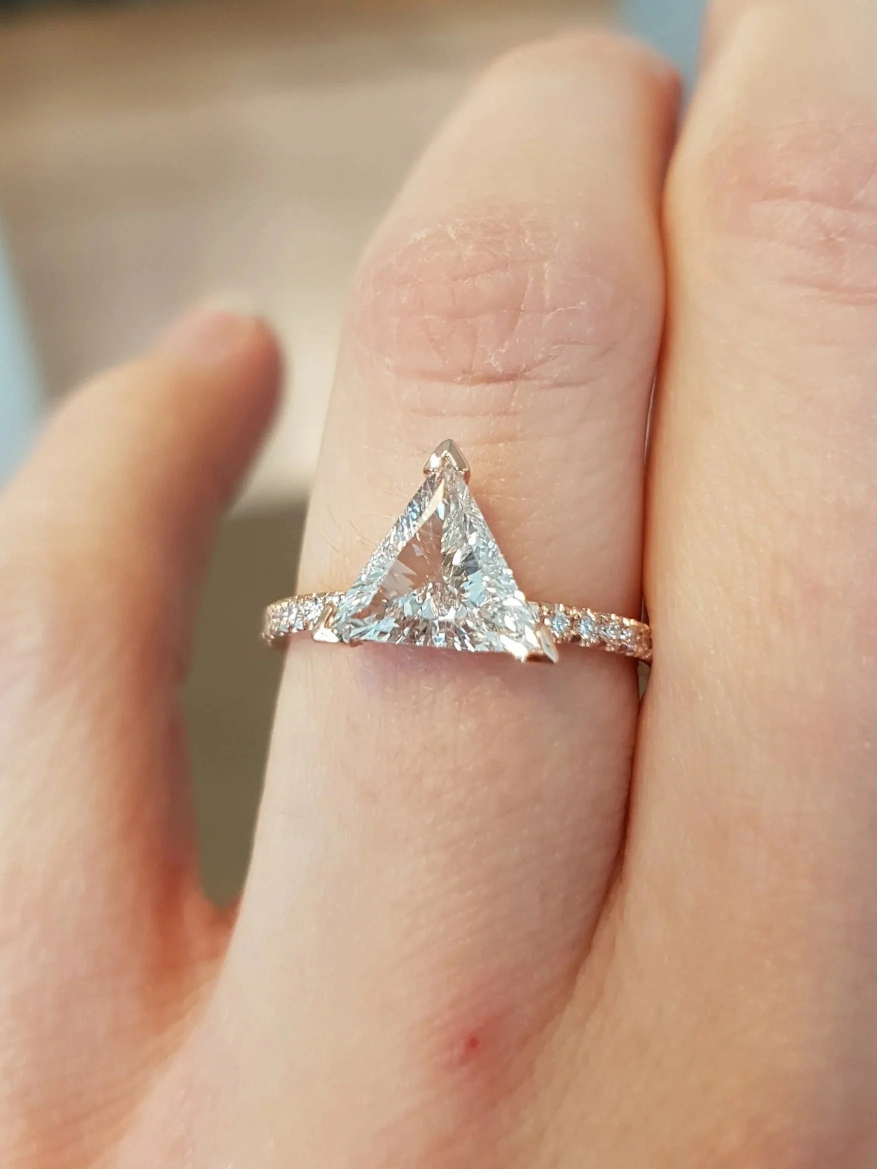 Trillon cut diamond engagement ring set in rose gold