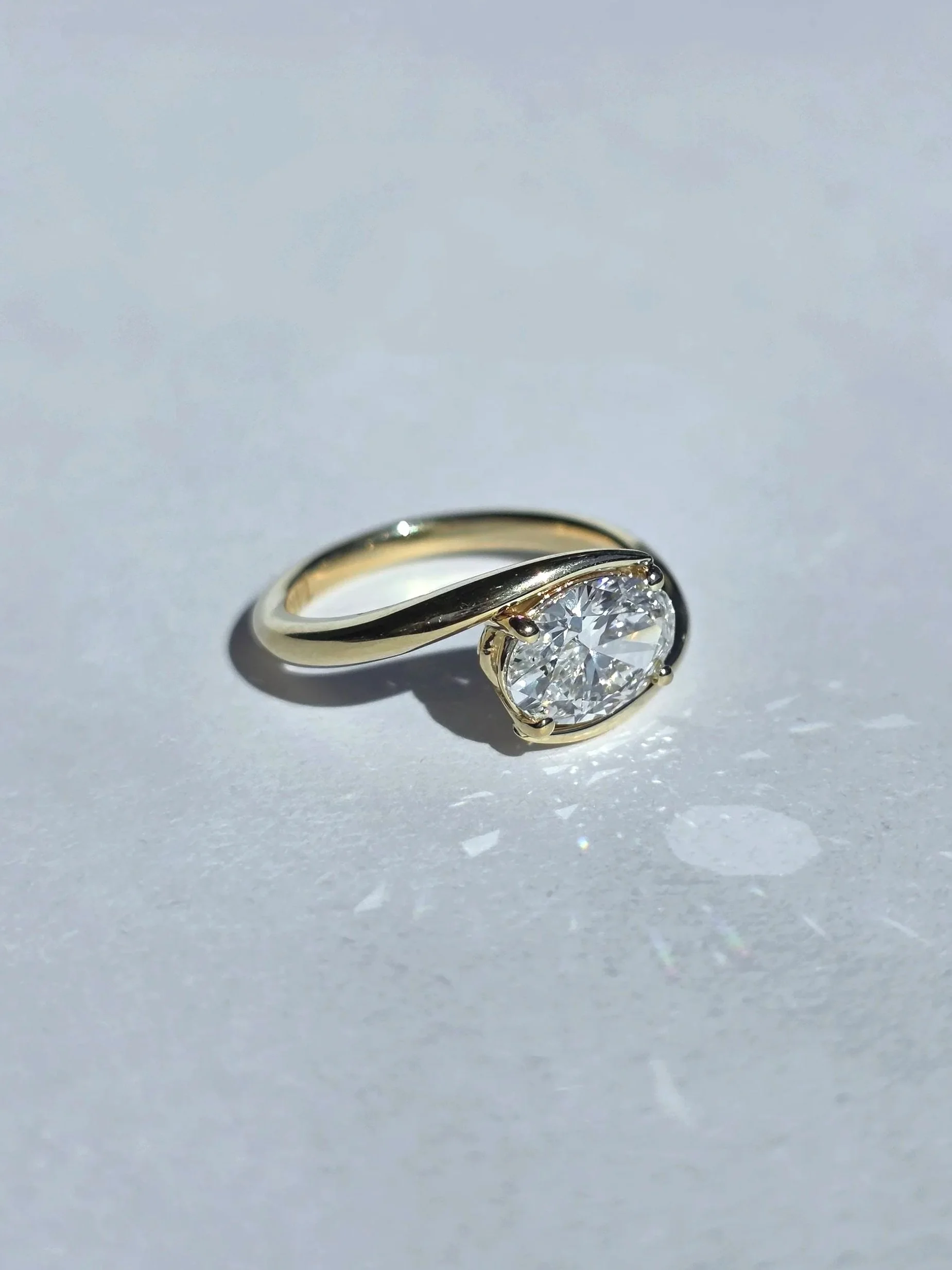 East west bypass oval solitaire in yellow gold
[engagement]