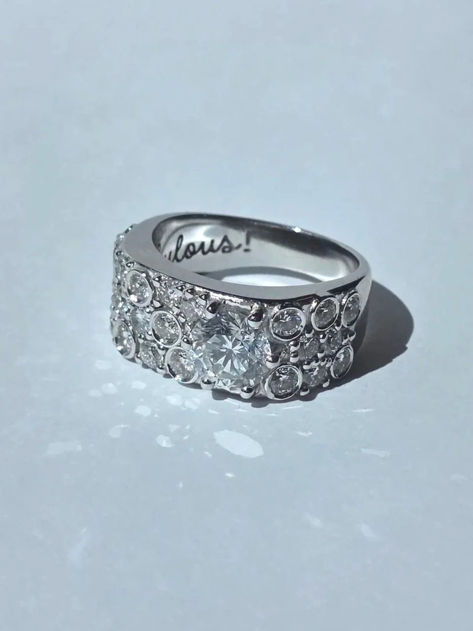 Custom white gold wide band ring using client's provided jewellery and diamonds
[redesign]