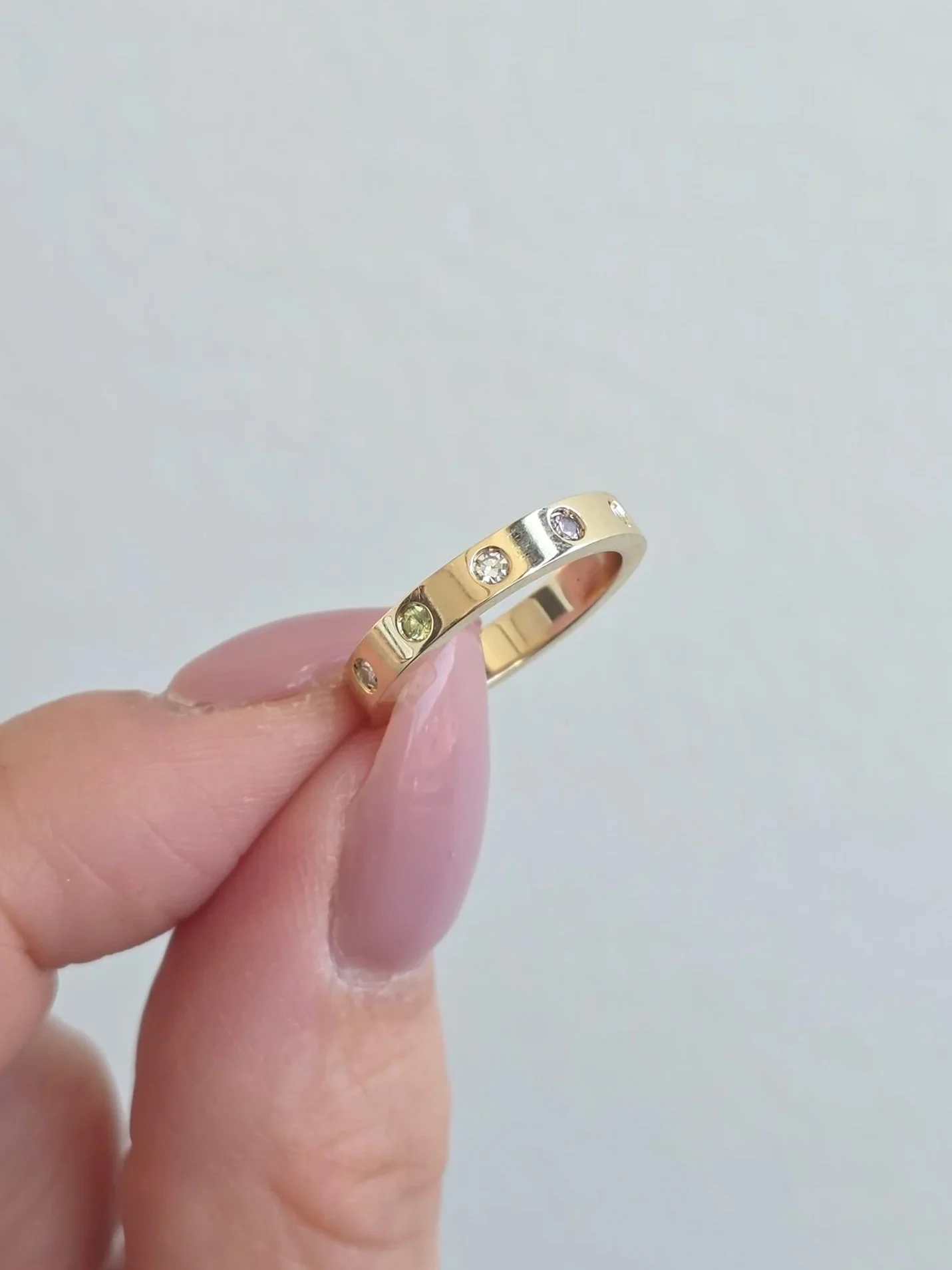 Custom 14K yellow gold family pinky ring set with client's diamonds and new birthstones
[redesign]