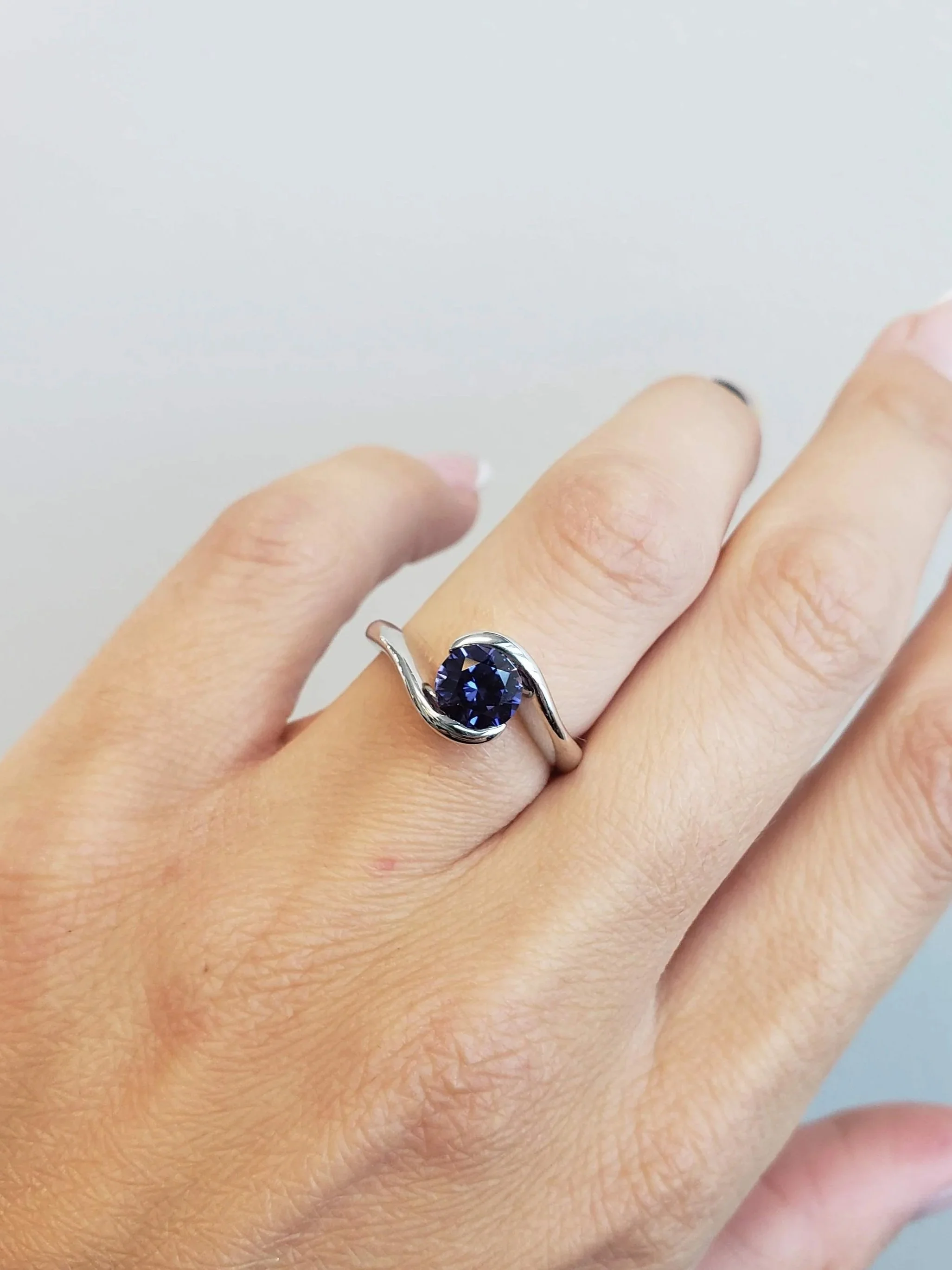 Purple sapphire bypass style engagement ring
[gemstone]