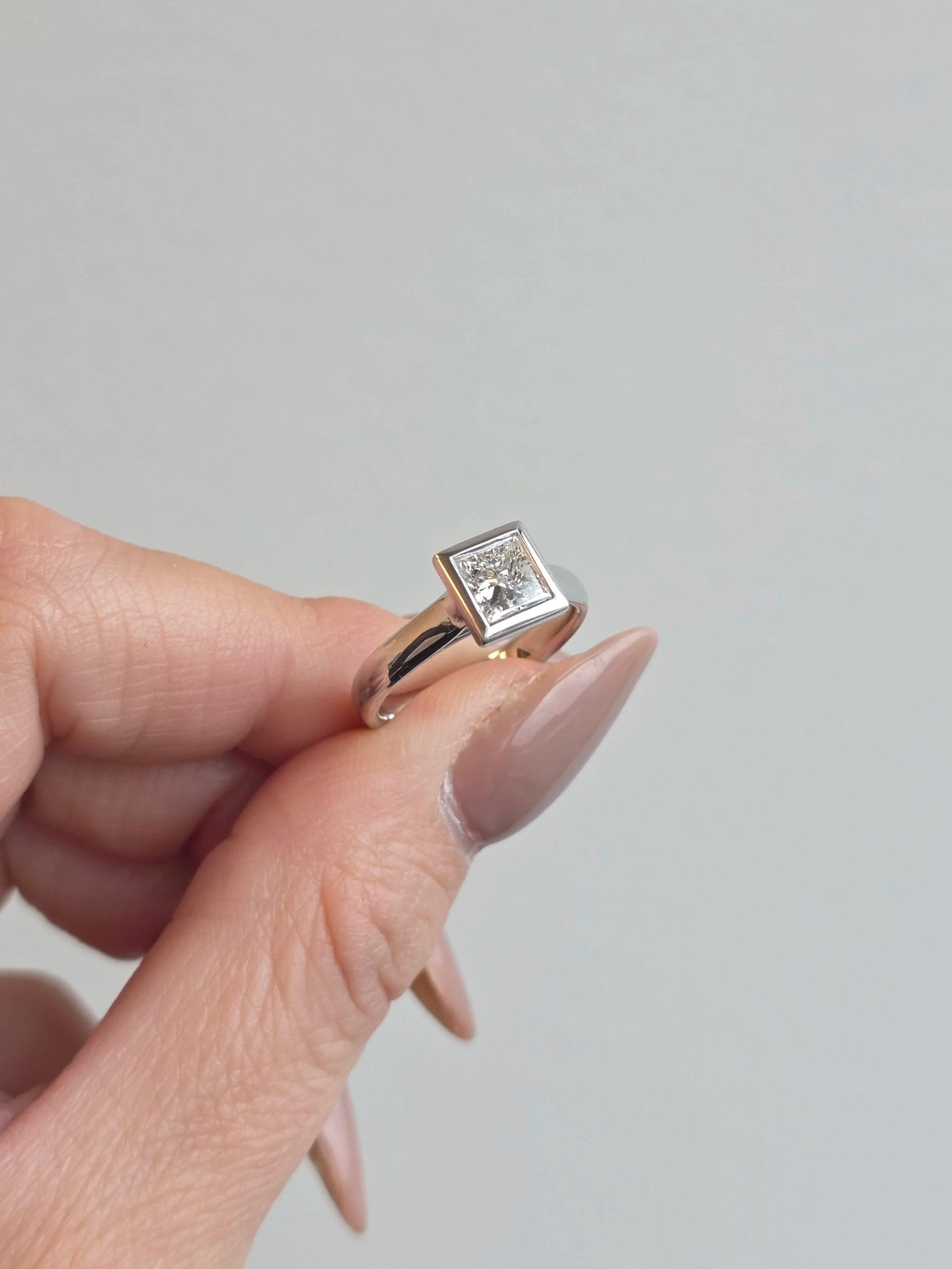 Princess cut bezel set engagement ring
[engagement]
[redesign]
