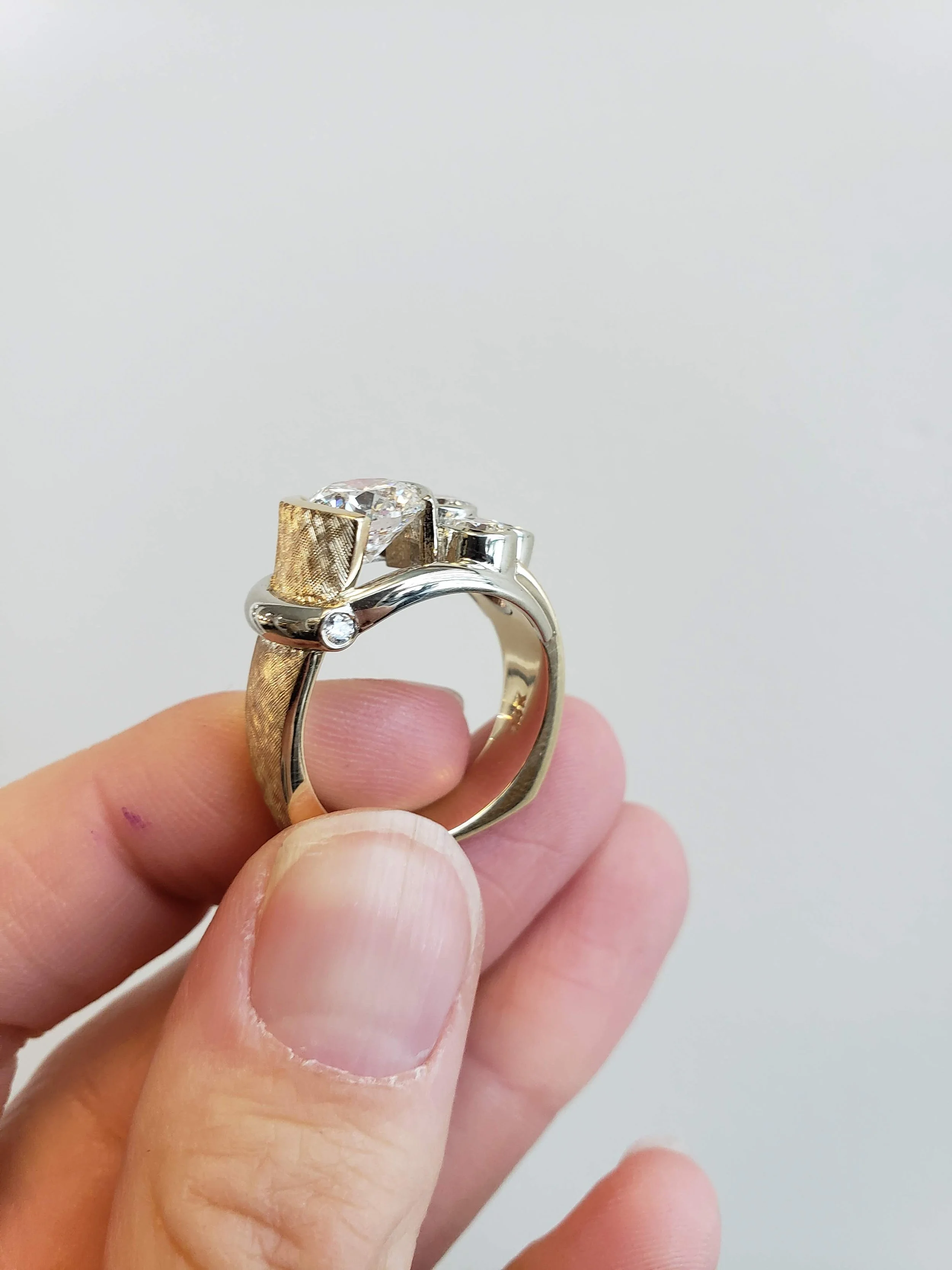 Heirloom diamond redesign project with cross hatched texture, semi-bezel and bezel set diamonds in yellow and white gold