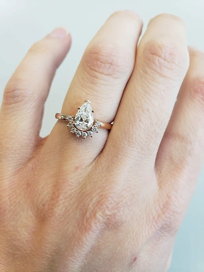 Pear shaped diamond halo engagement ring in rose gold