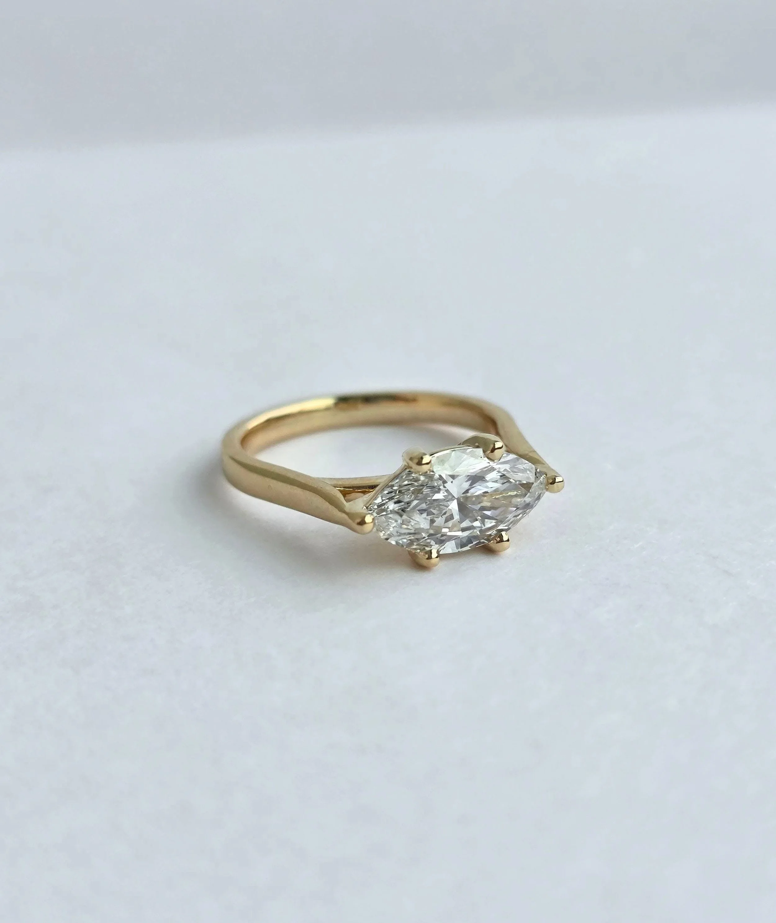 Custom East-West marquise diamond engagement ring in 14K yellow gold