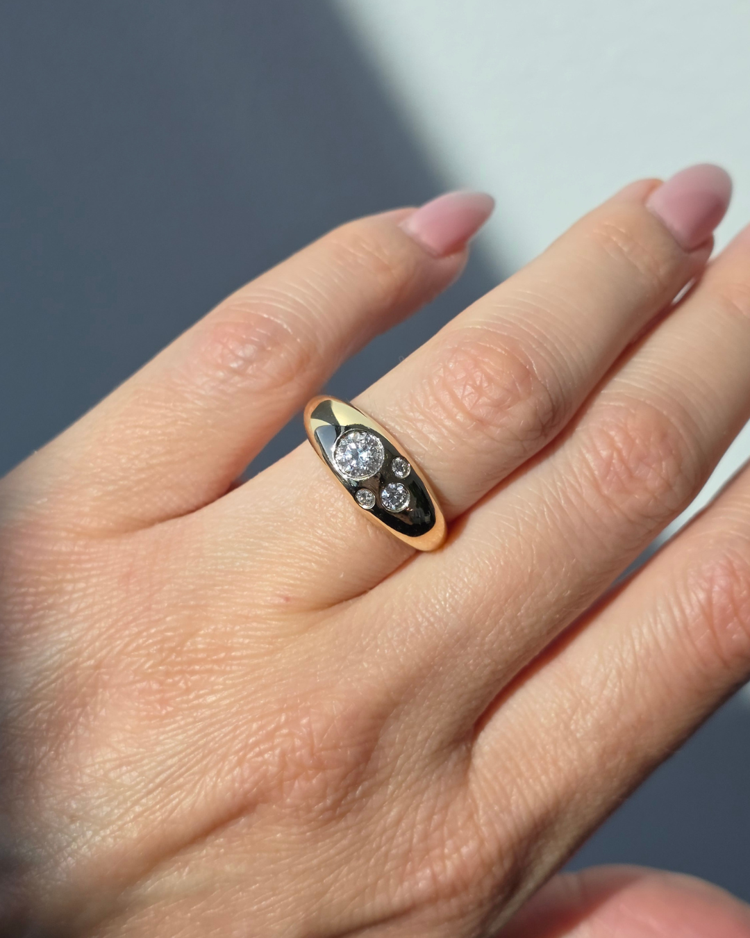 Custom 14K yellow gold bubble signet ring using client's diamonds
[redesign]